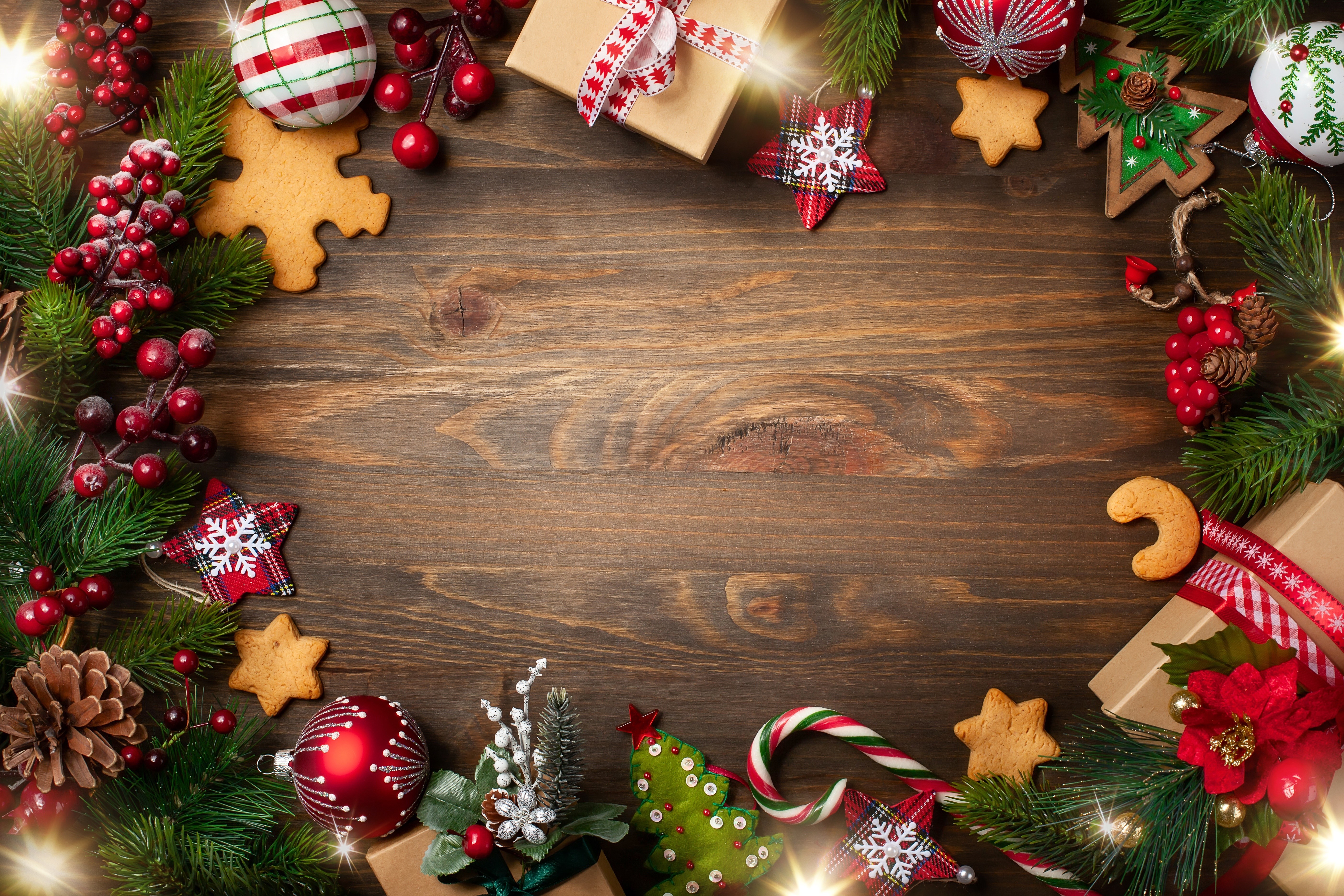 Christmas decorations and treats on a wooden table HD Wallpaper