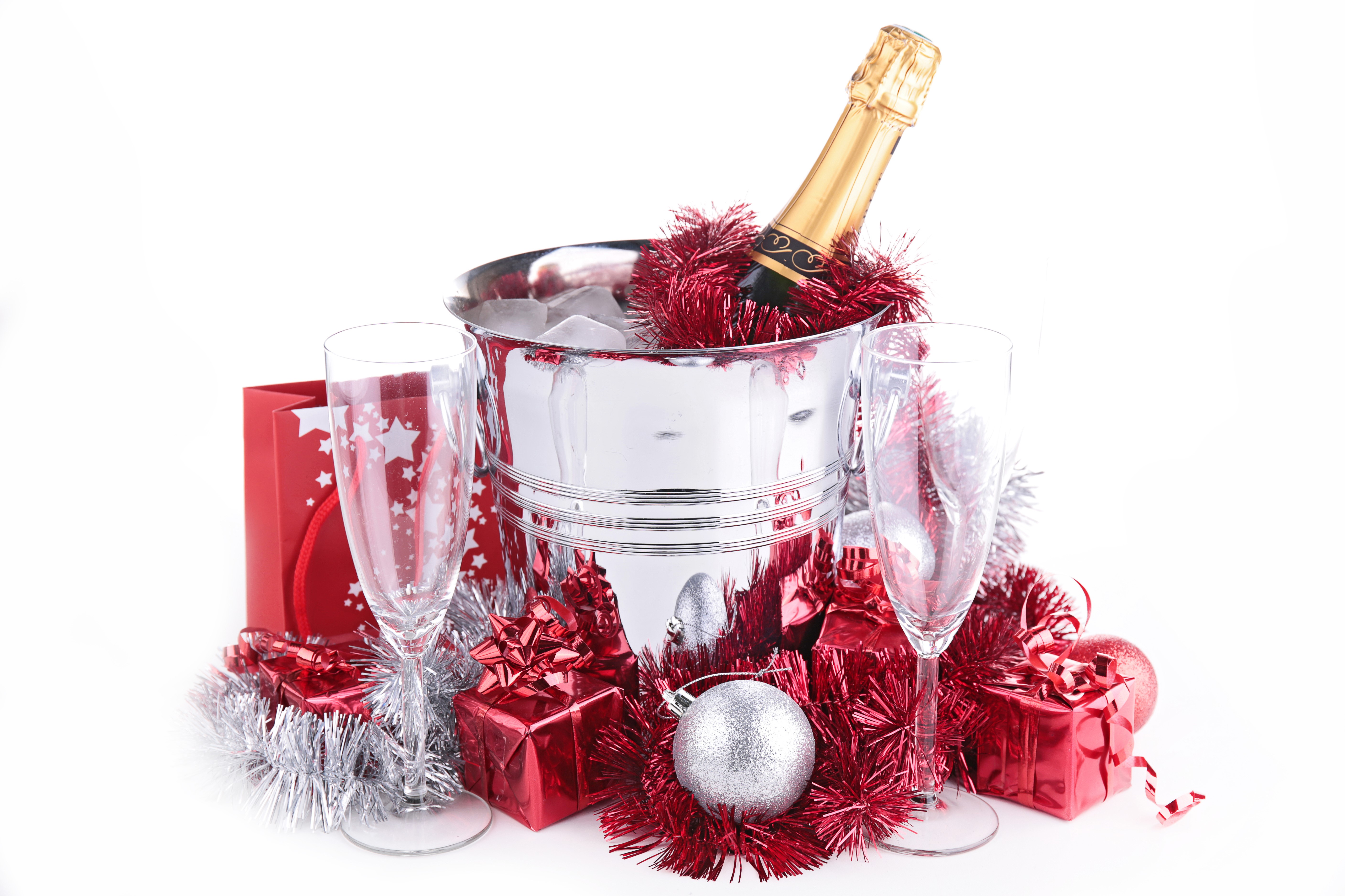 Champagne bottle in ice bucket with gifts and glasses HD Wallpaper