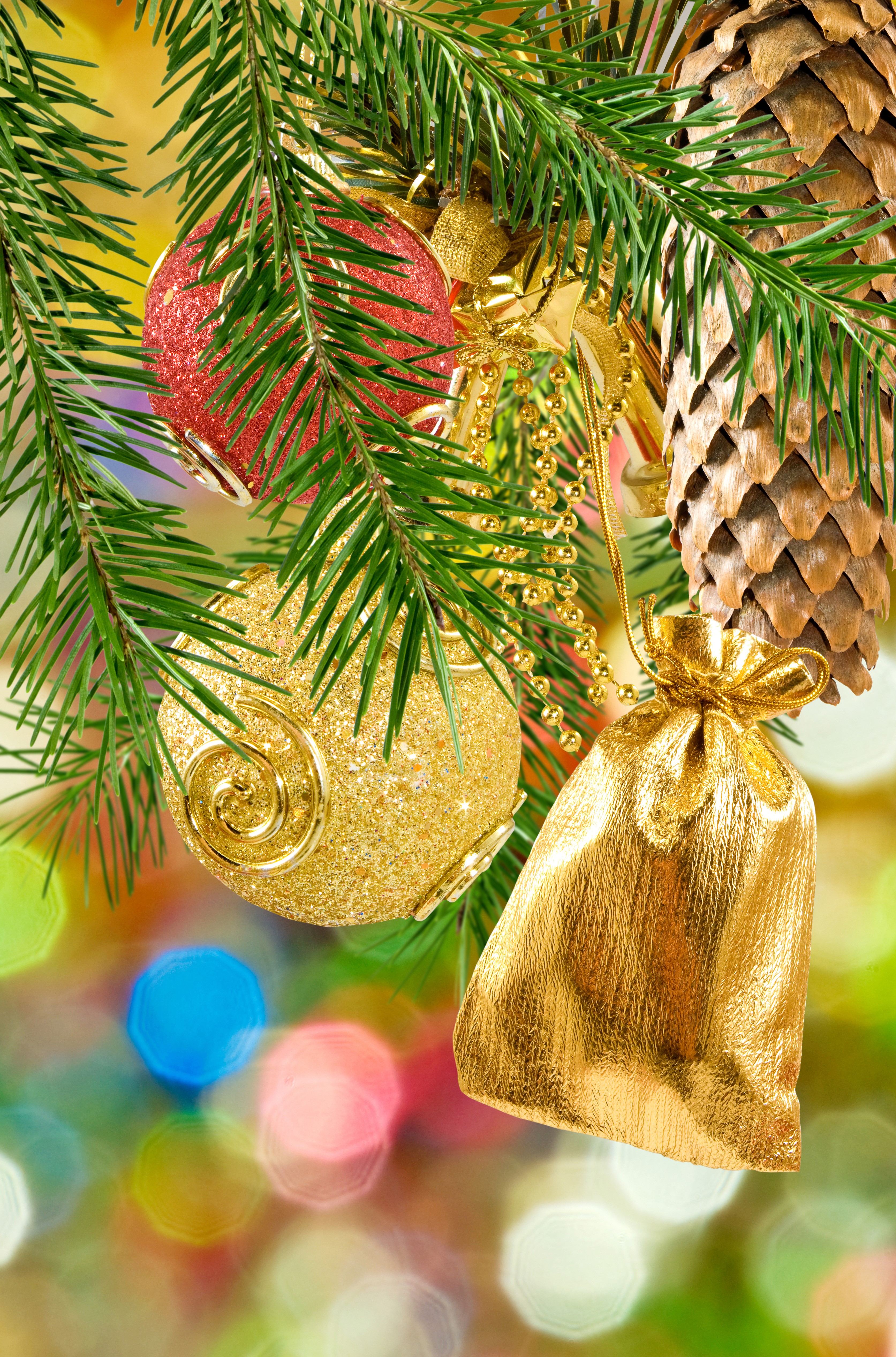 Christmas tree branches with ornaments and pine cone HD Phone Wallpaper