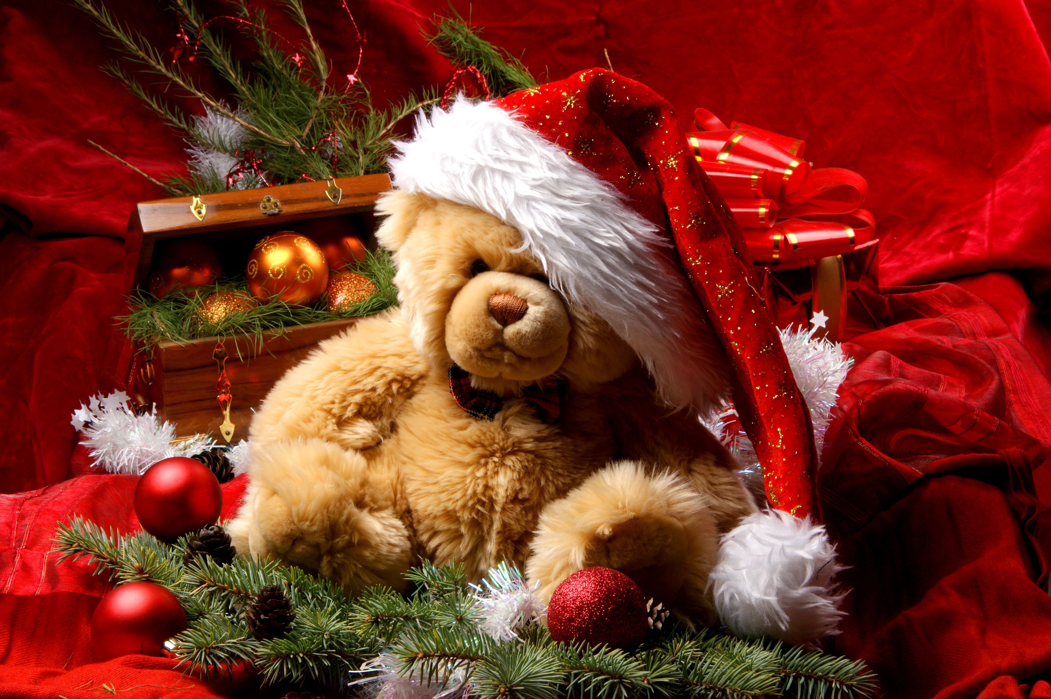 Teddy bear wearing Santa hat with Christmas ornaments HD Wallpaper