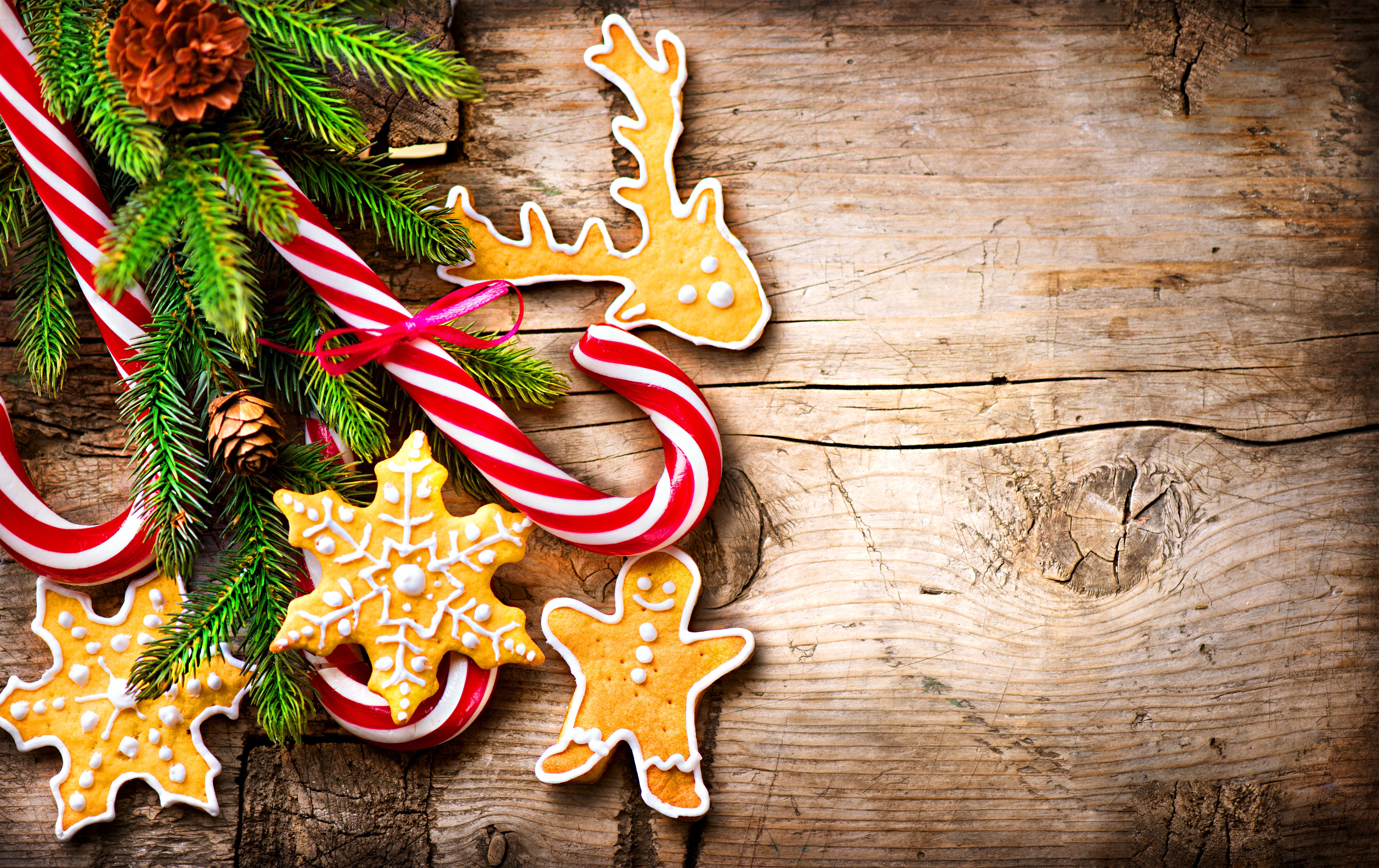 Christmas cookies and candy canes on wood HD Wallpaper