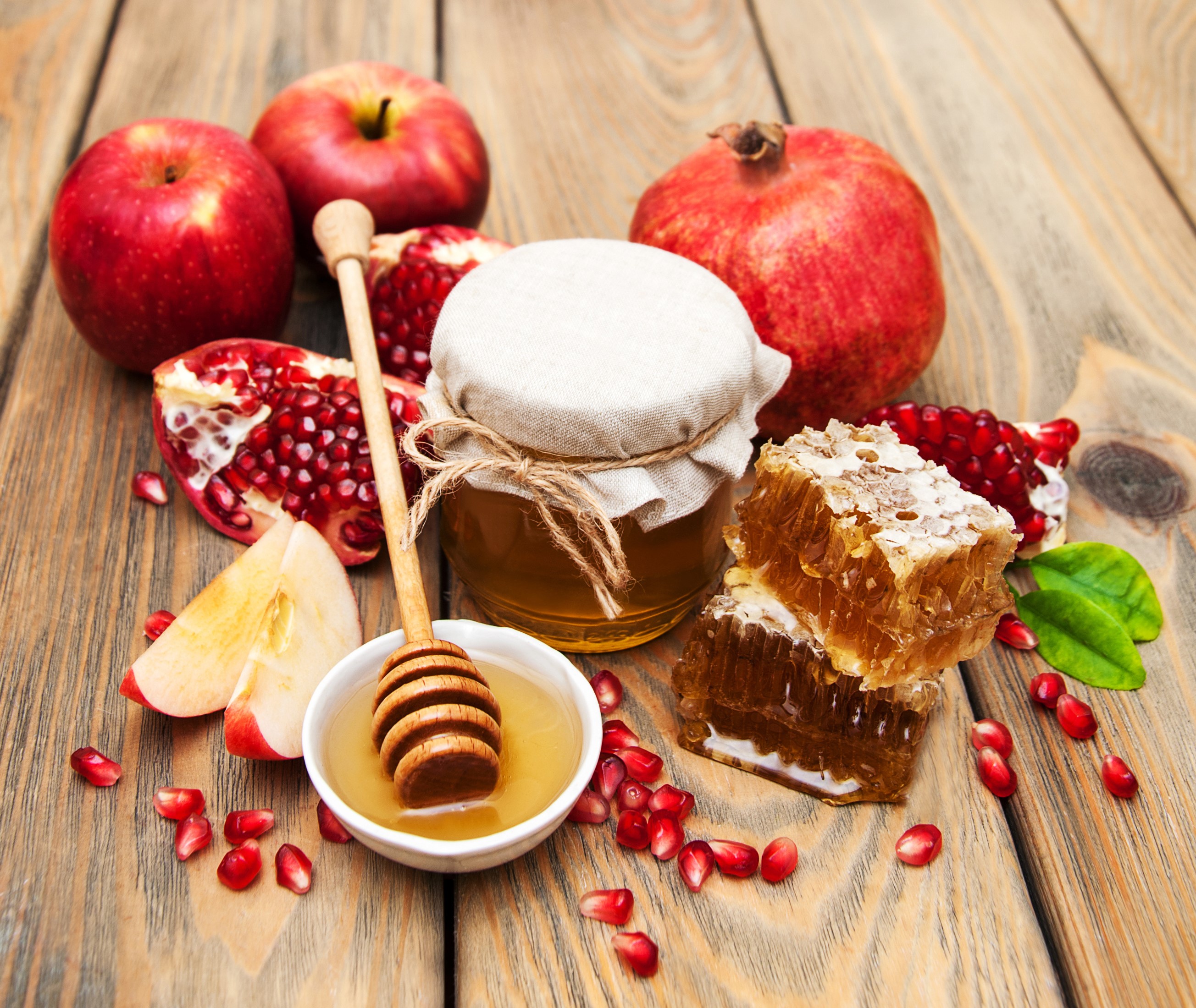 Apples, Pomegranate, Honey, and Honeycomb on Wood HD Wallpaper