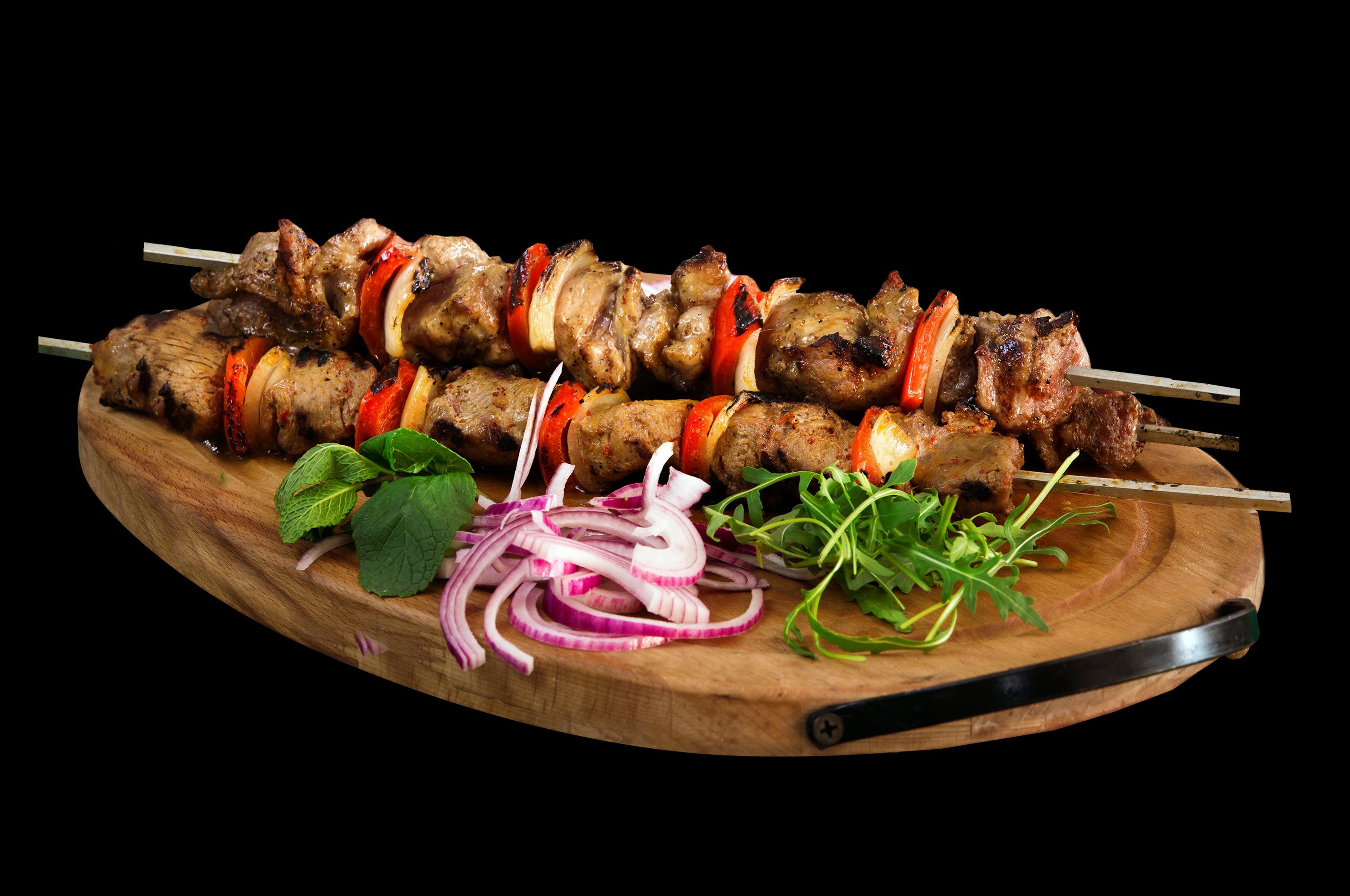 Shashlik skewers with onion and greens on a cutting board HD Wallpaper