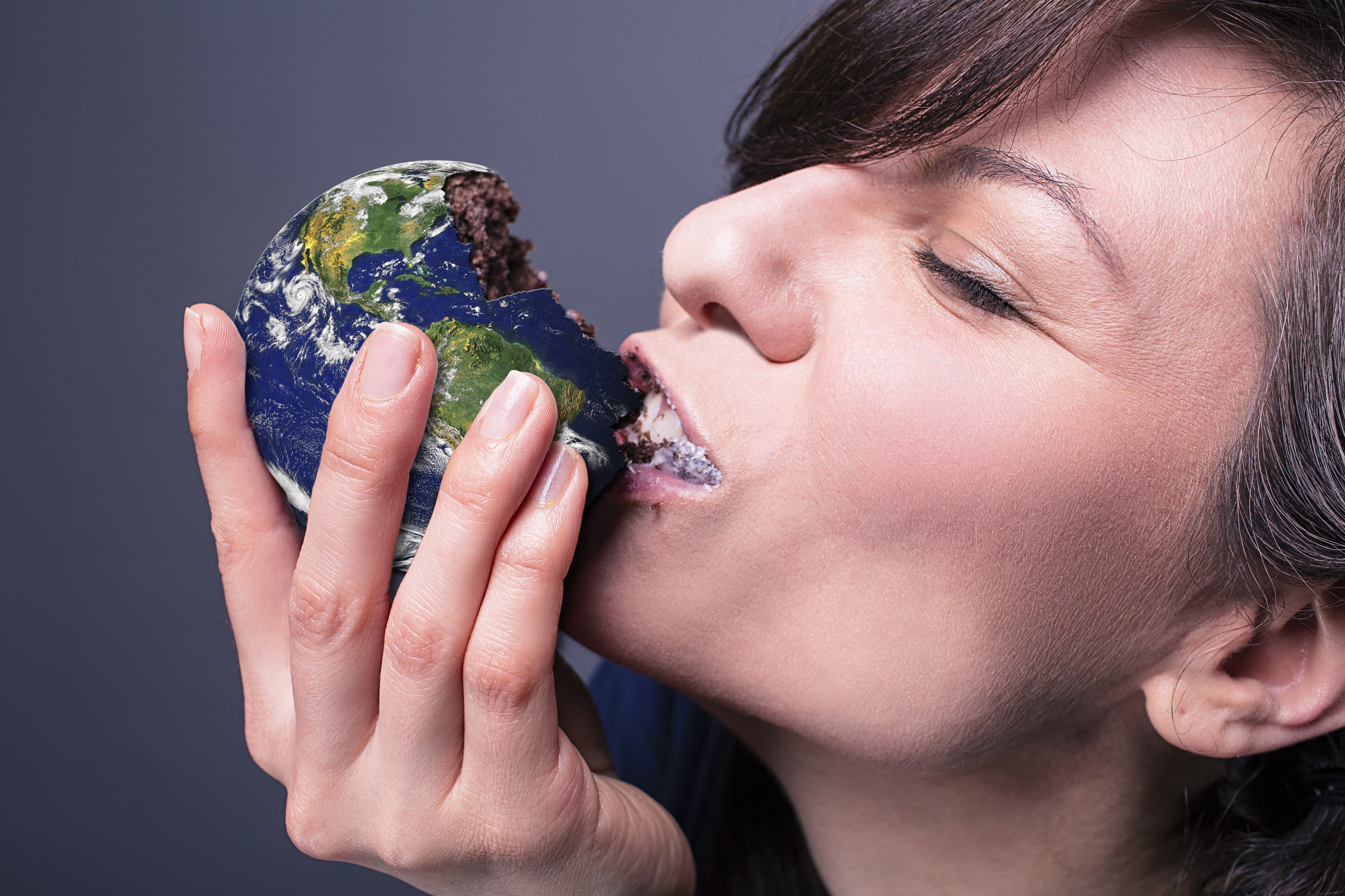 Woman eating a cake shaped like Earth HD Wallpaper