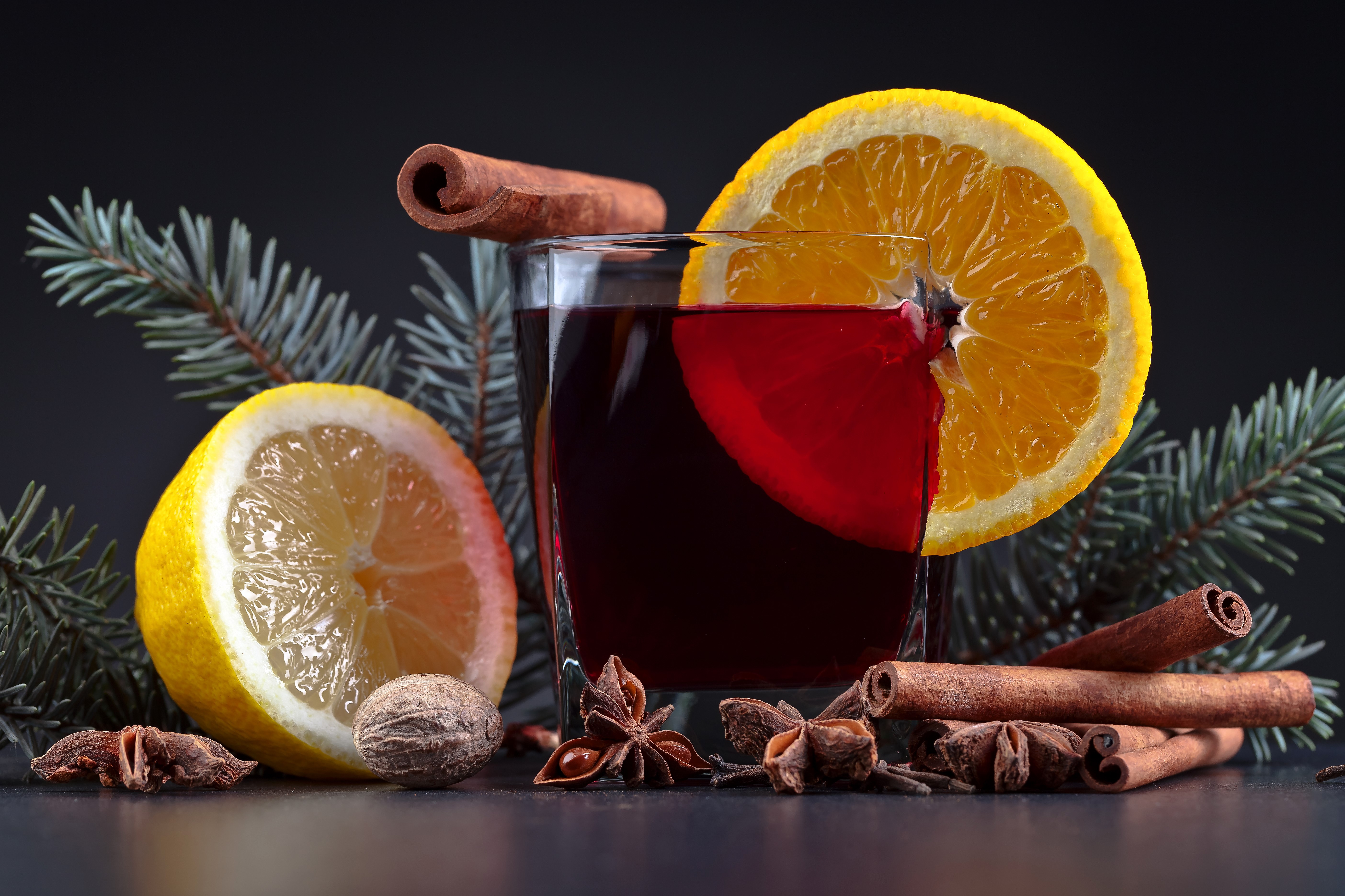 Mulled wine with orange, lemon, cinnamon, and star anise HD Wallpaper