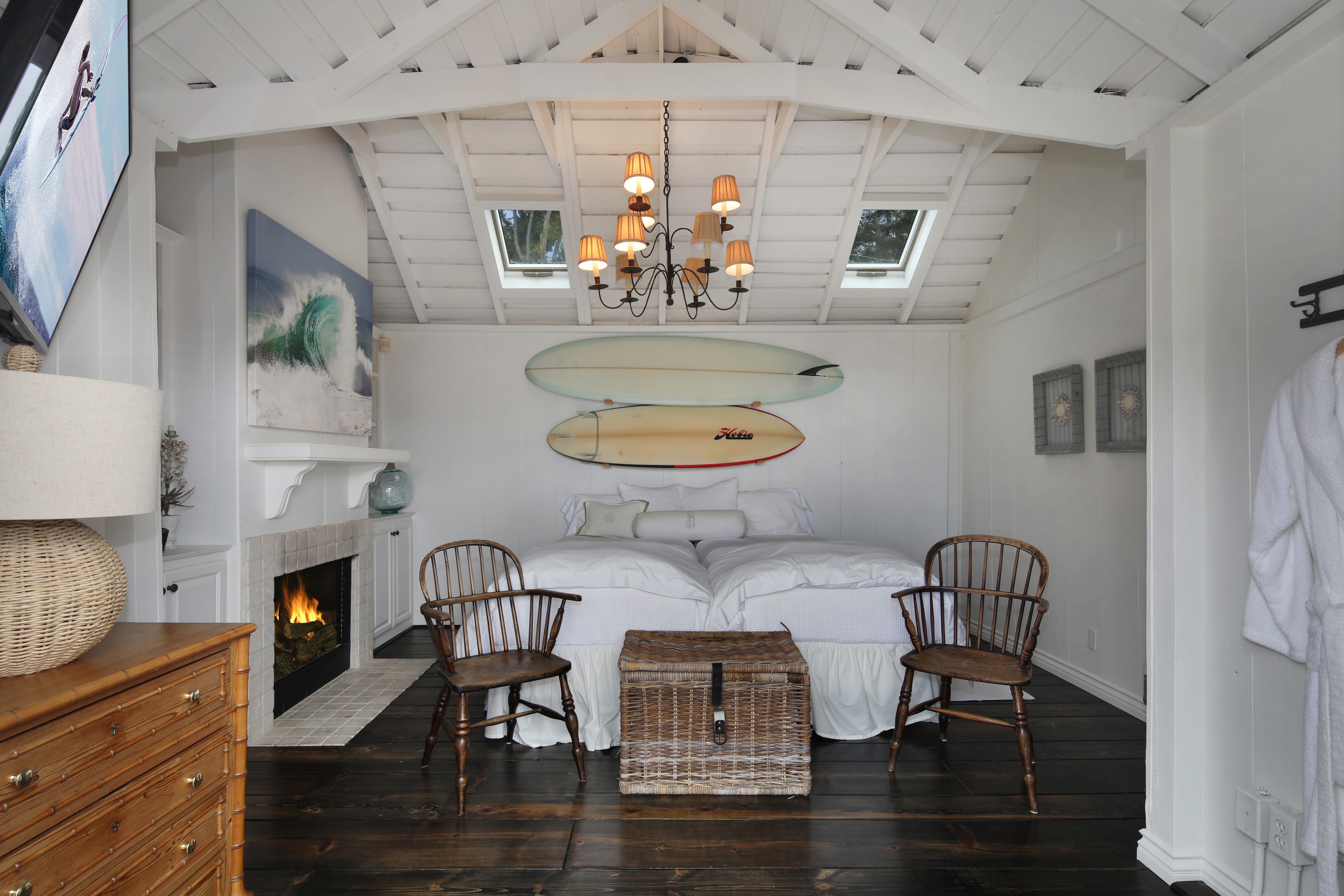 Bedroom with surfboards and fireplace HD Wallpaper