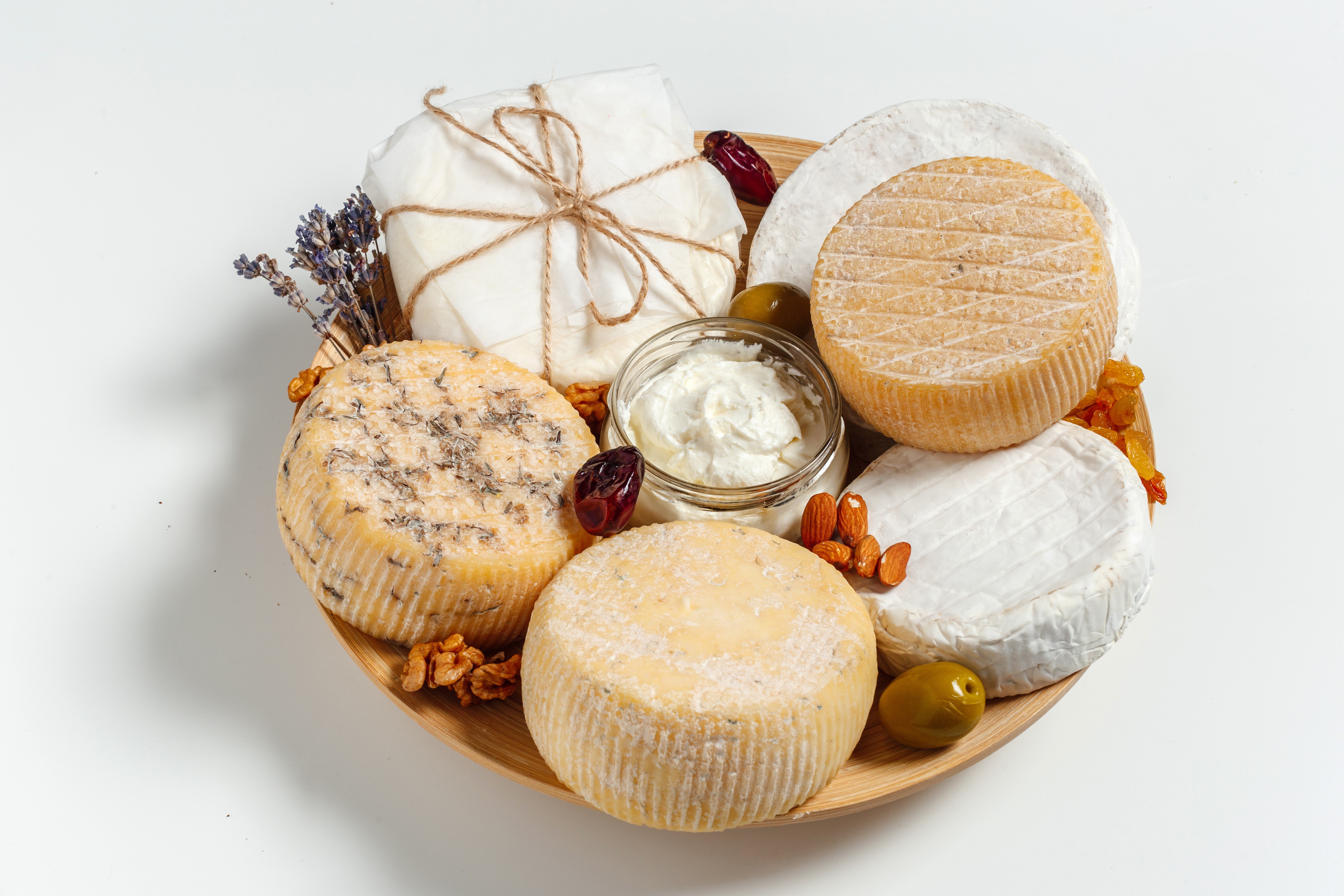 Cheese platter with nuts, olives, and dried fruit HD Wallpaper