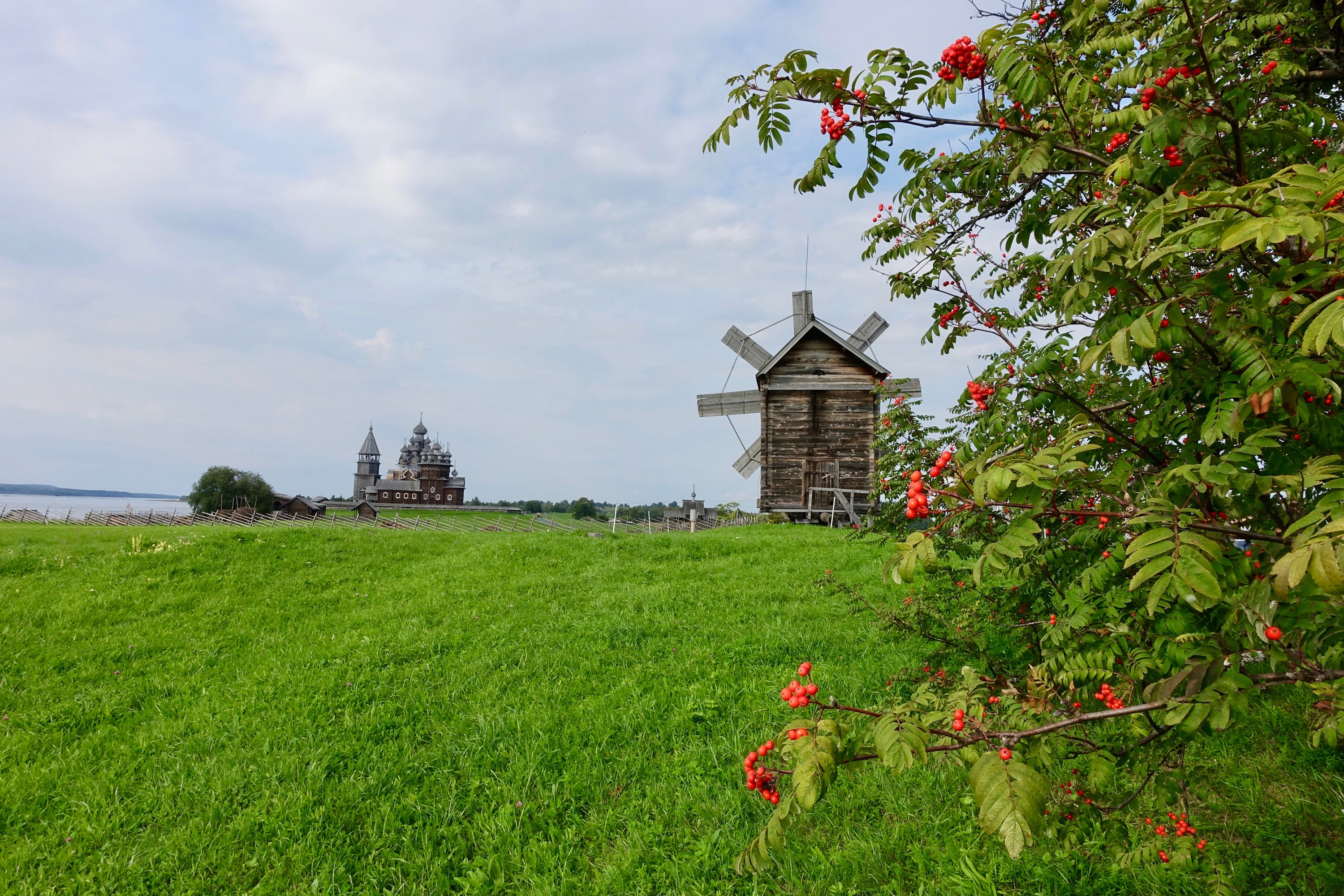 Wooden church and windmill on Kizhi Island, Russia HD Wallpaper