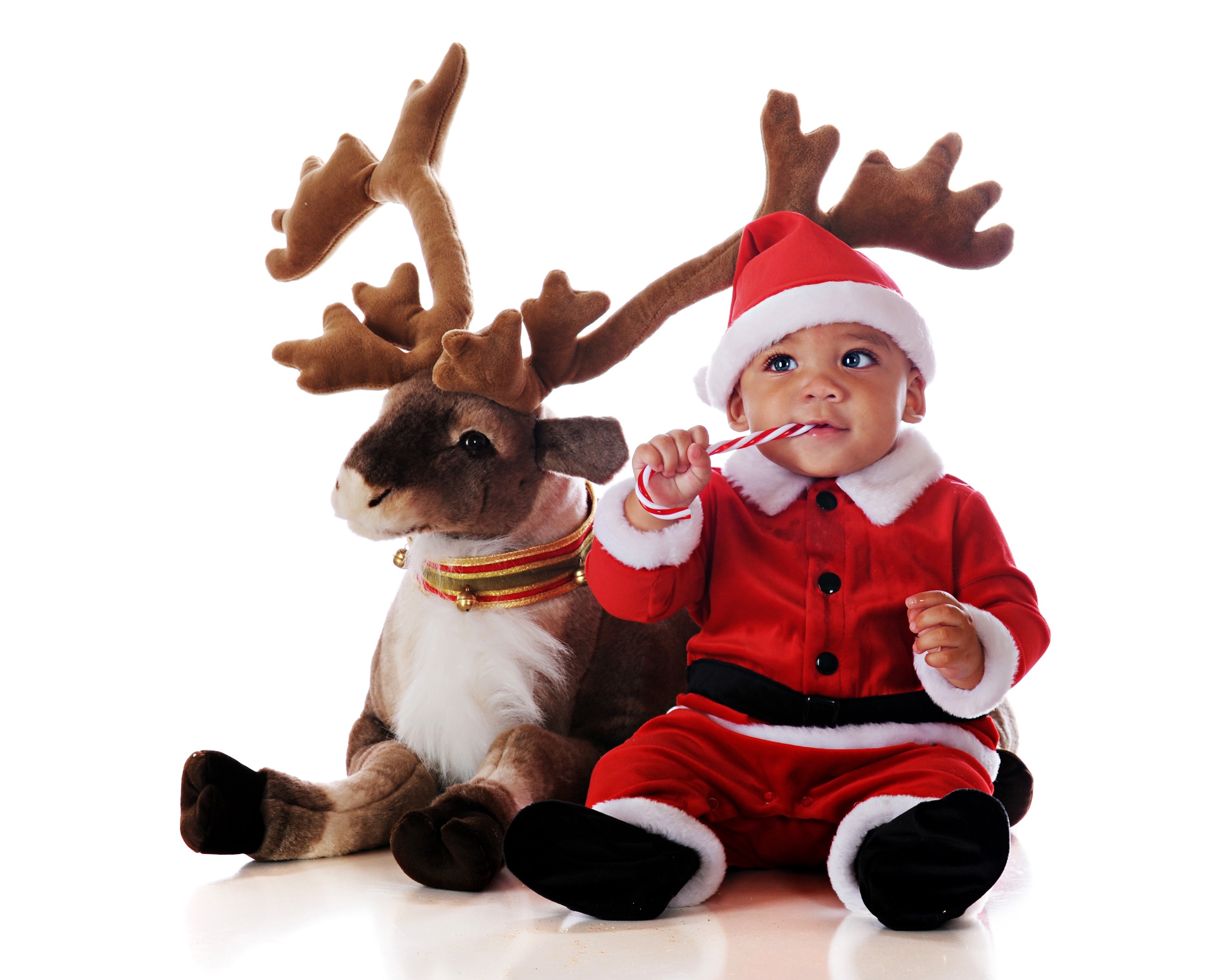 Baby in Santa costume with a reindeer and candy cane HD Wallpaper