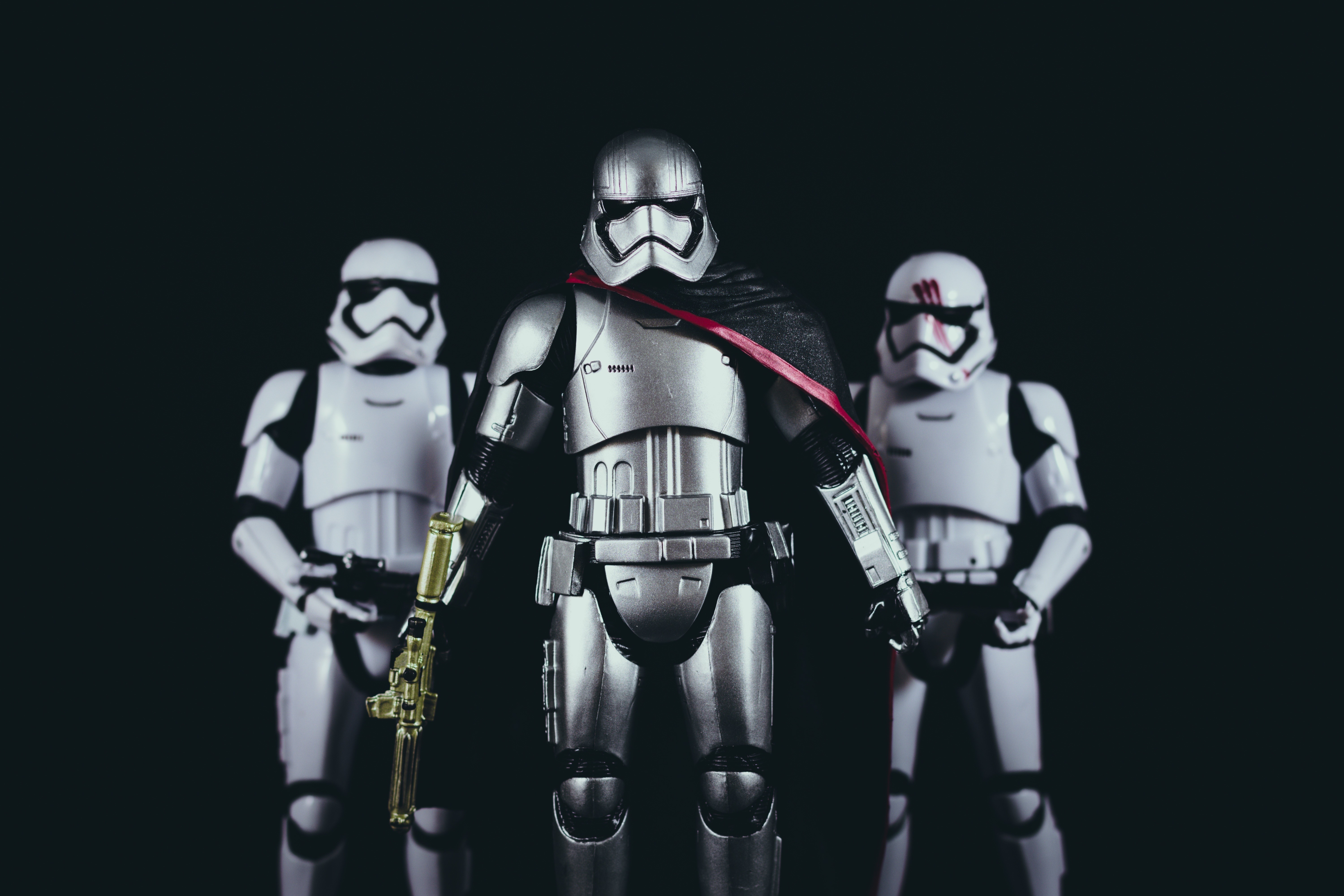 Three Star Wars Stormtrooper action figures on black background HD Wallpaper