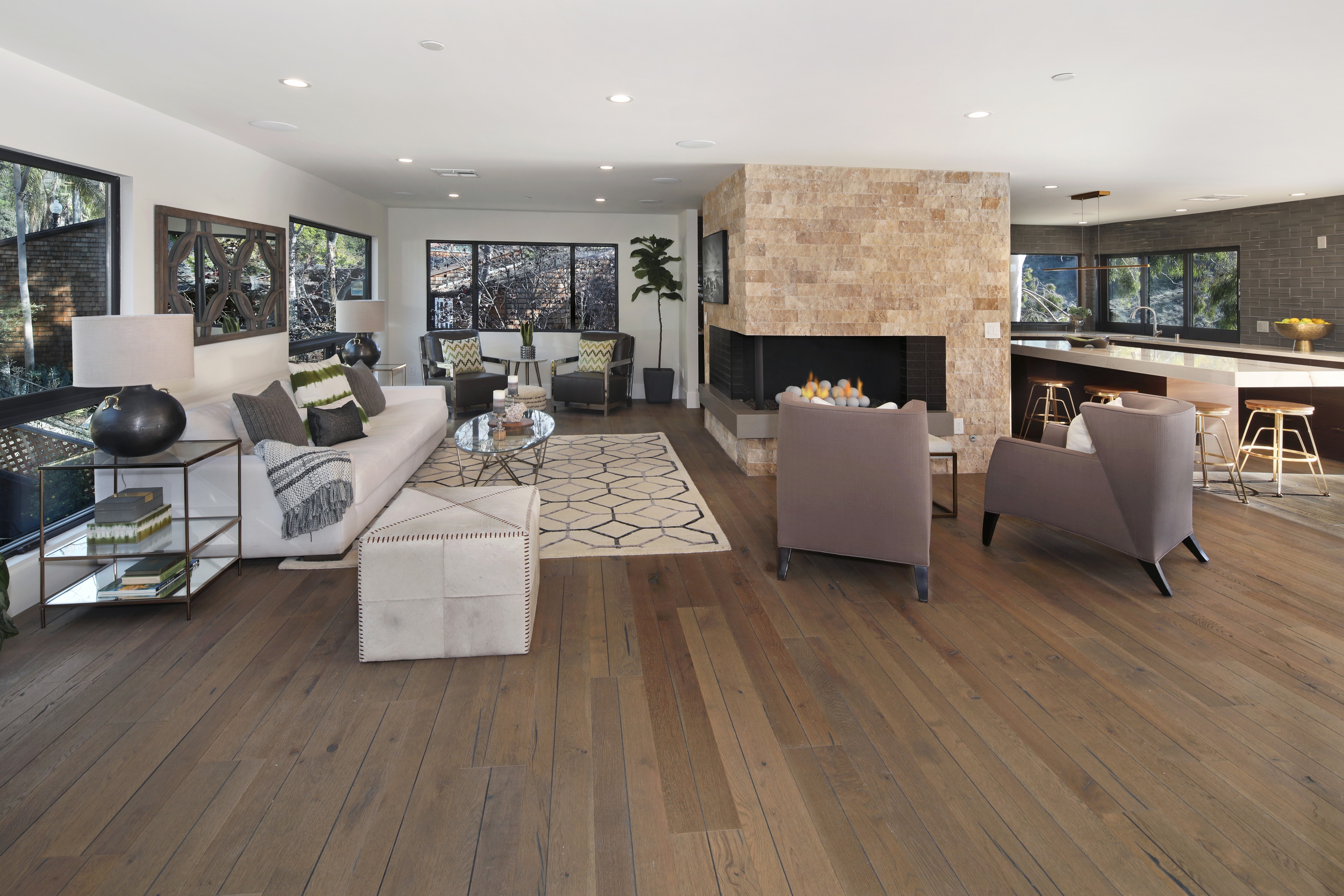 Living room with sofa, armchair, and fireplace HD Wallpaper