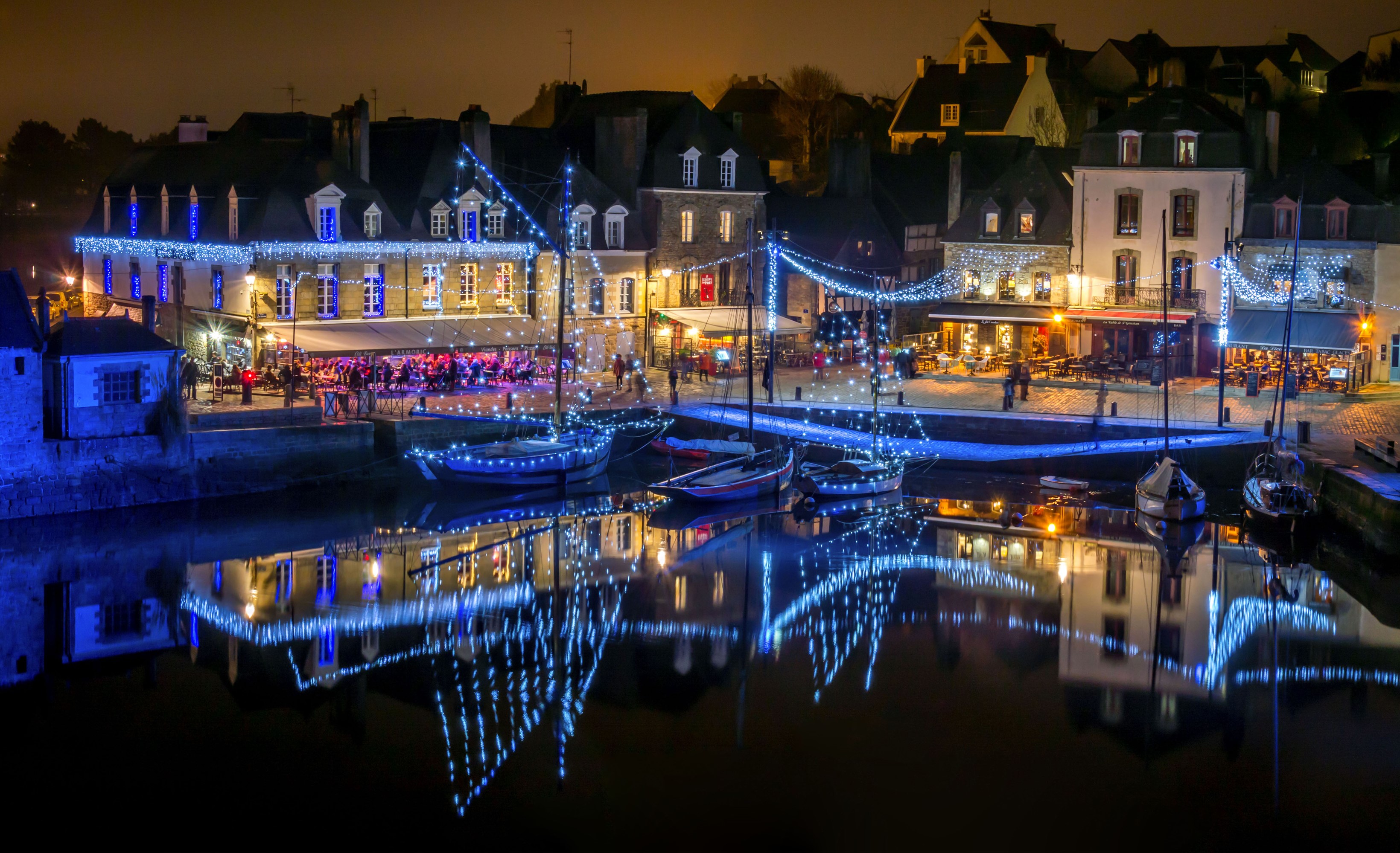 Auray, France waterfront decorated with fairy lights at night HD Wallpaper