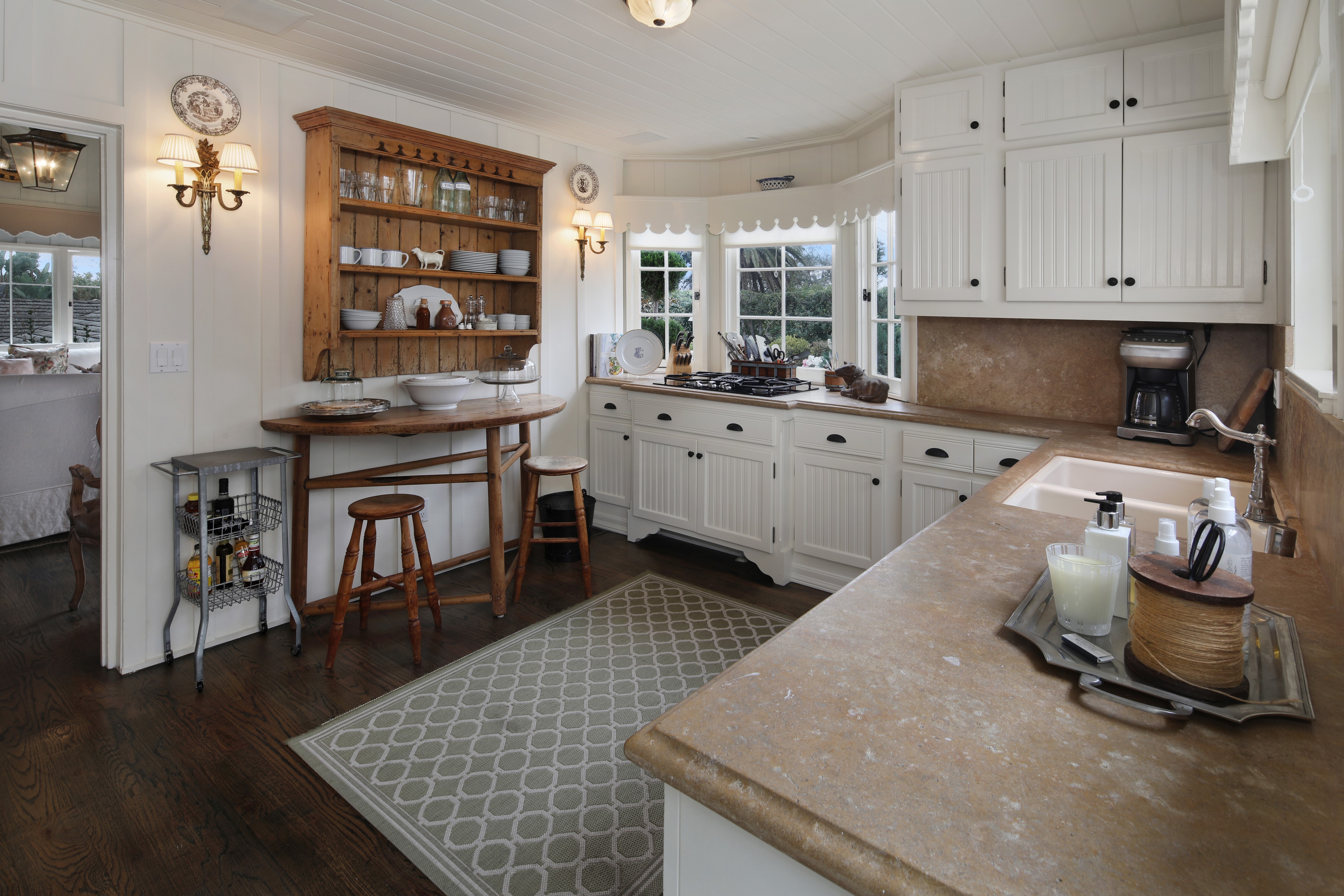 Kitchen with wooden hutch and bay windows HD Wallpaper