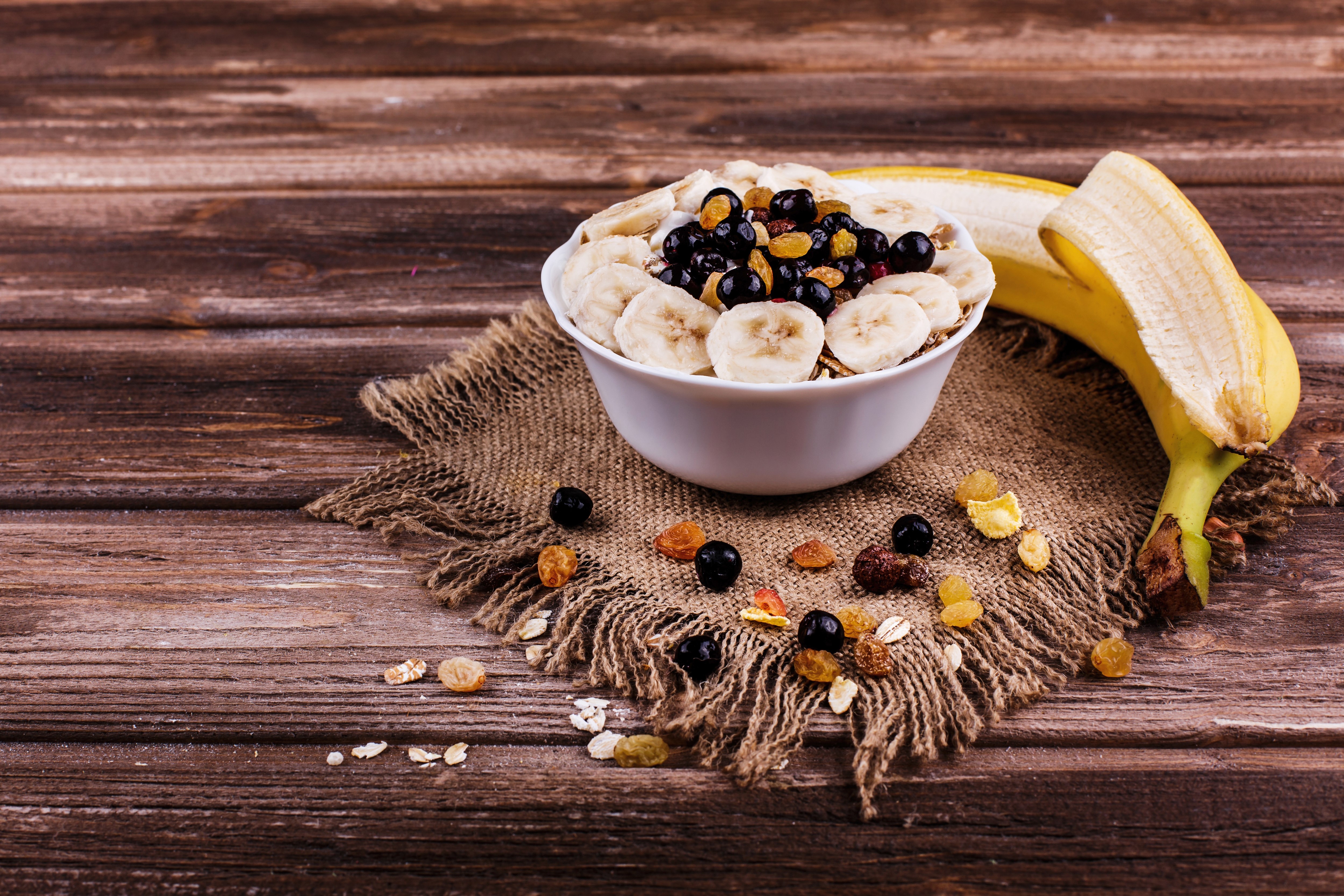 Bowl of Muesli with Bananas and Berries on Wood HD Wallpaper