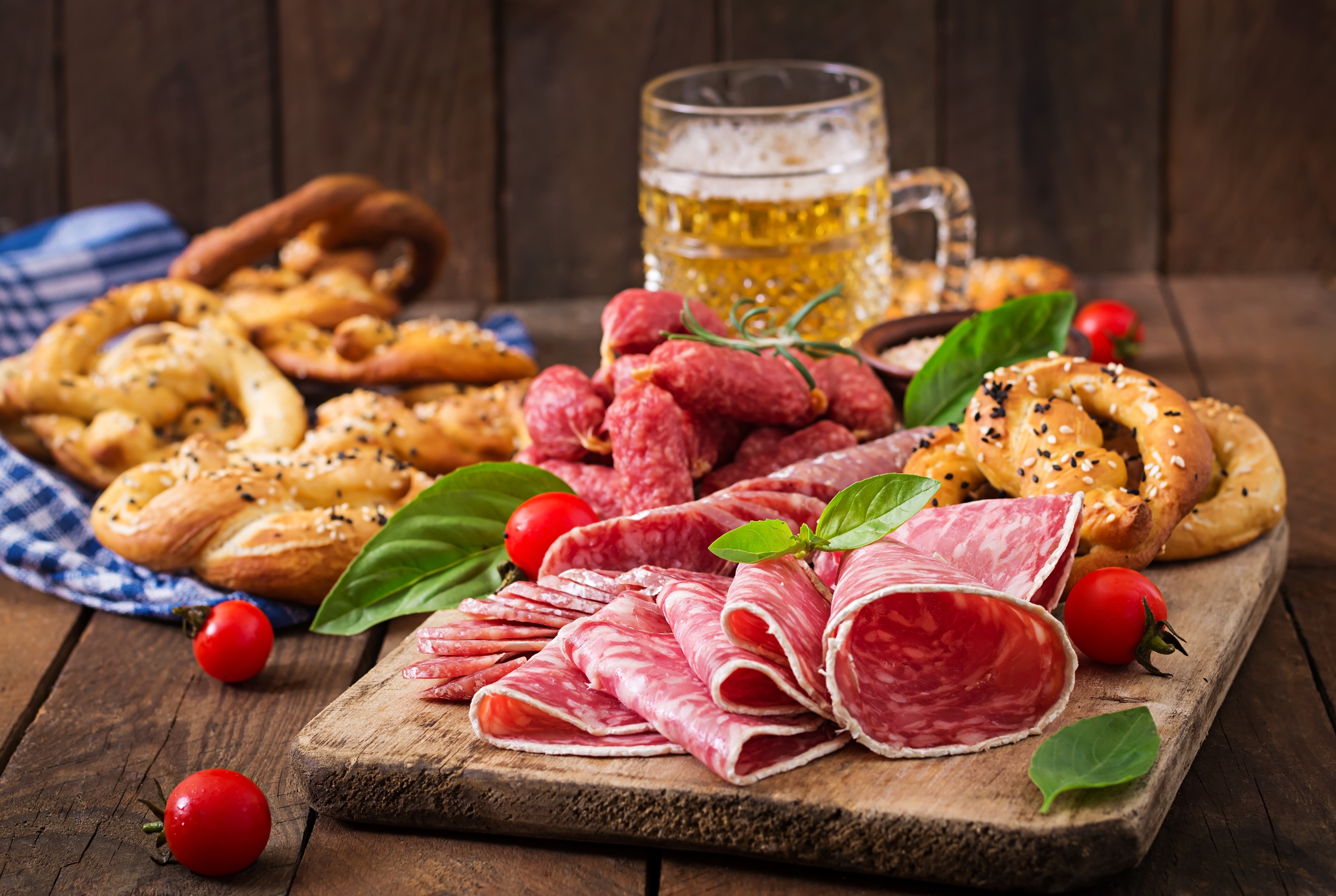 Sausage, Pretzels, and Beer on a Cutting Board HD Wallpaper