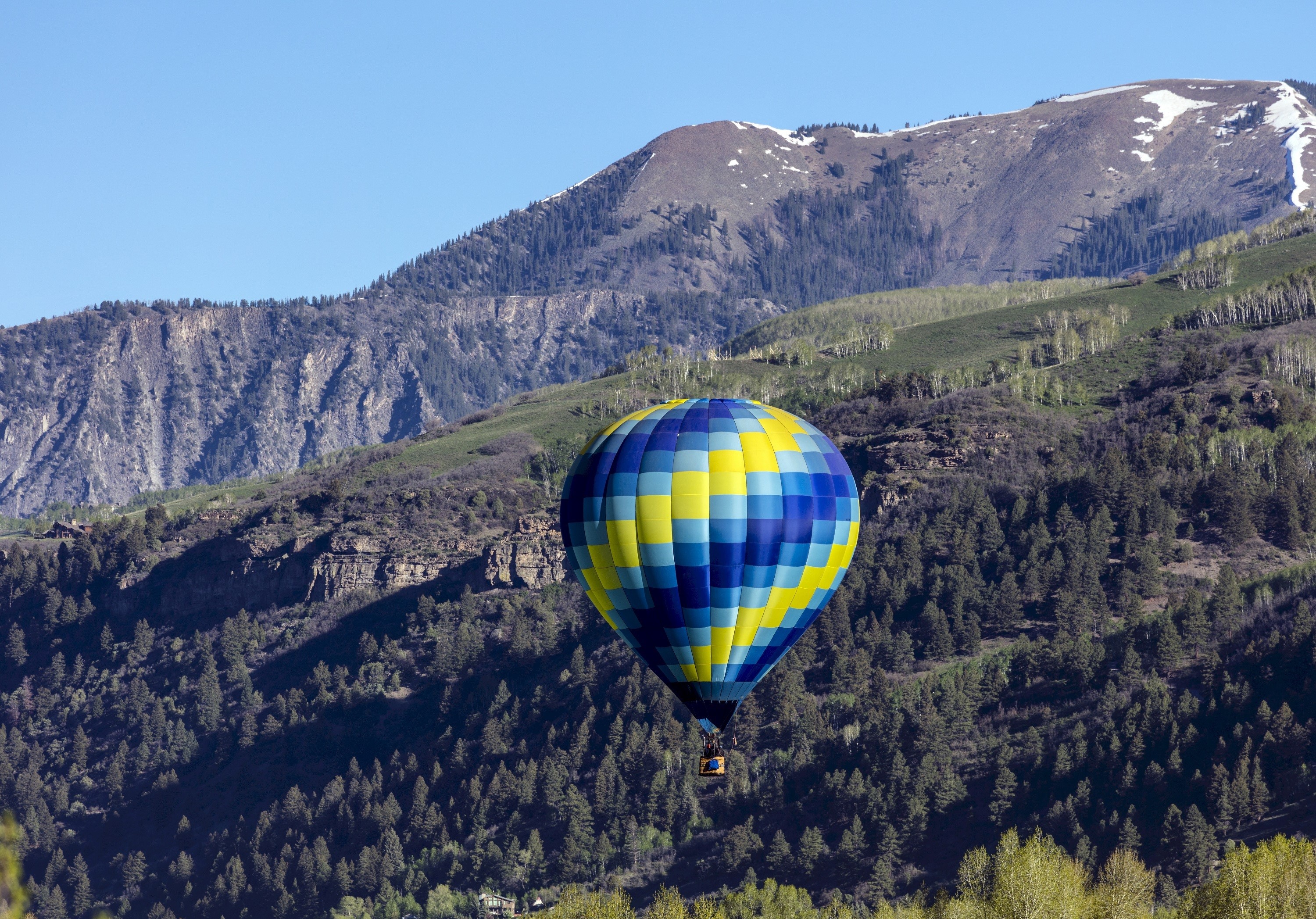 Hot air balloon over mountains HD Wallpaper
