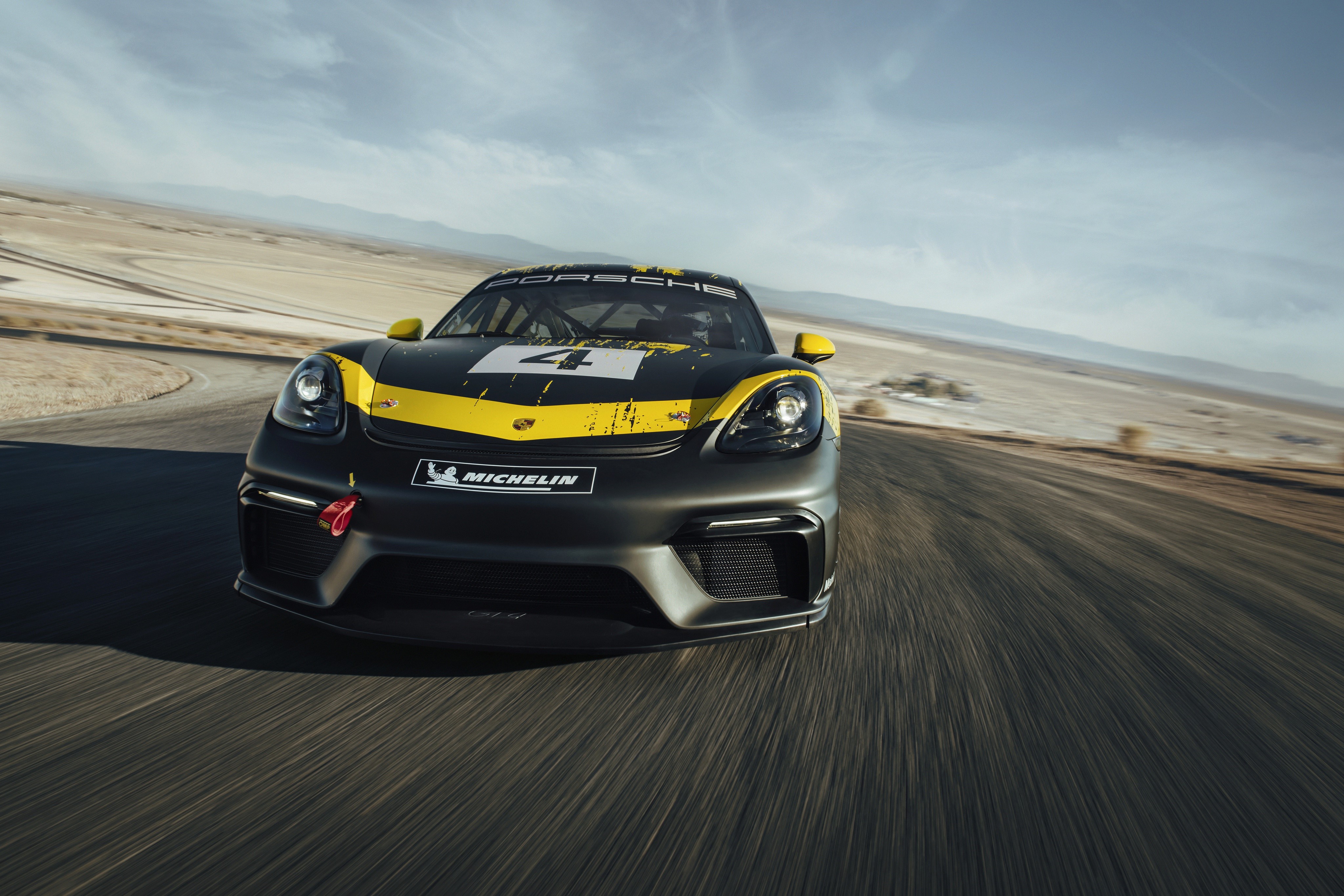 Porsche 718 Cayman GT4 Clubsport race car on track HD Wallpaper