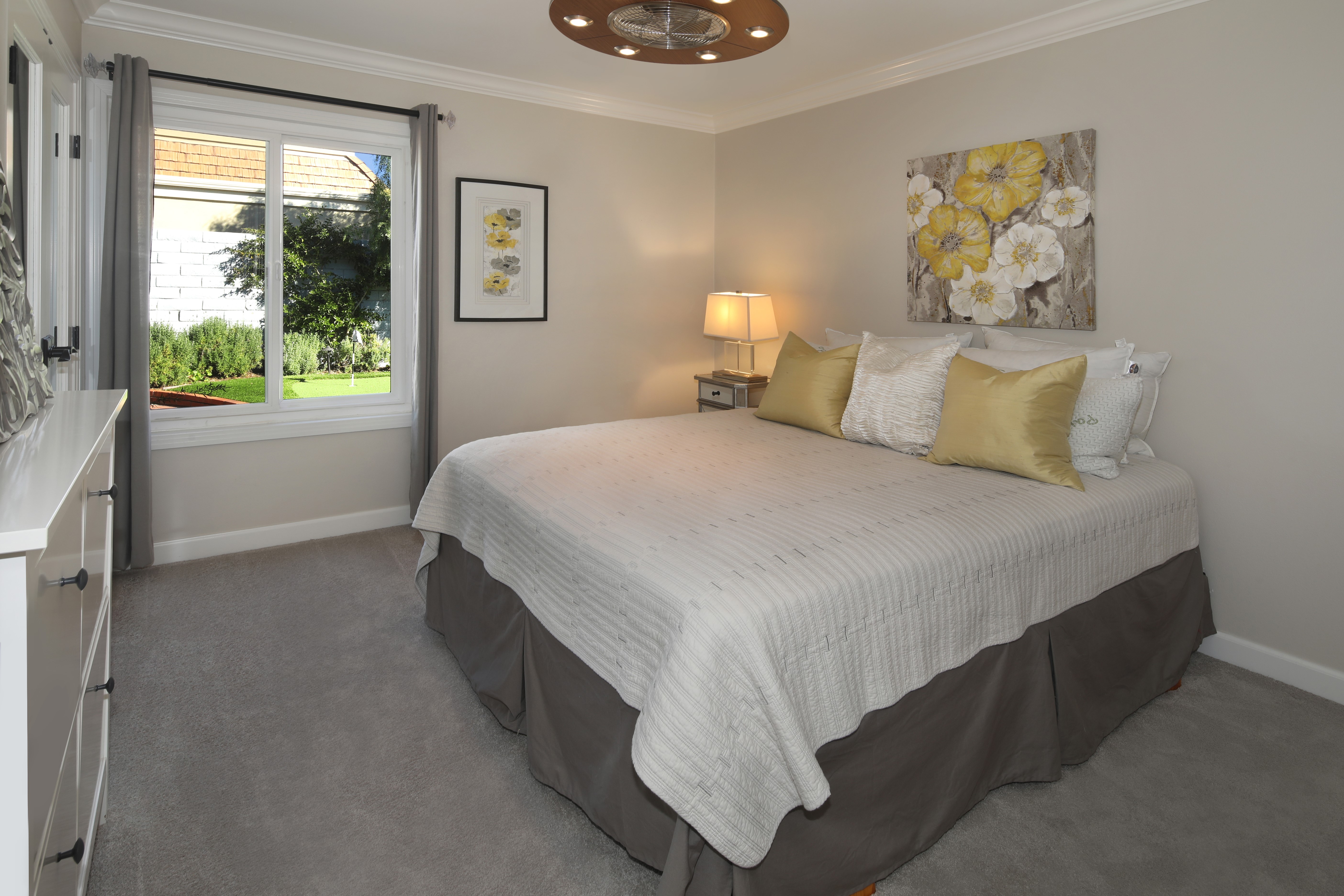 Bedroom with bed, pillows, and artwork HD Wallpaper