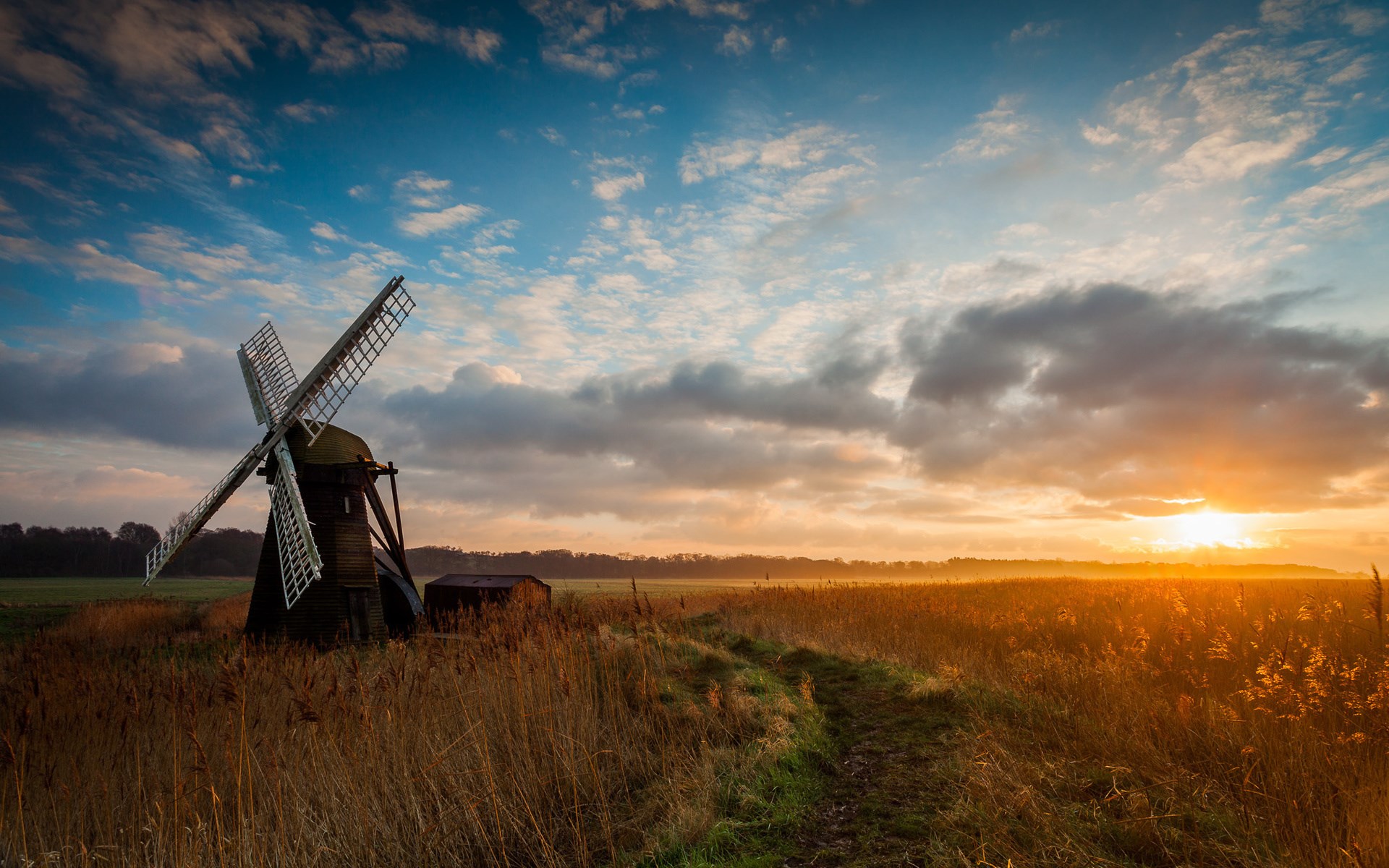 Windmill in a field at sunset HD Wallpaper