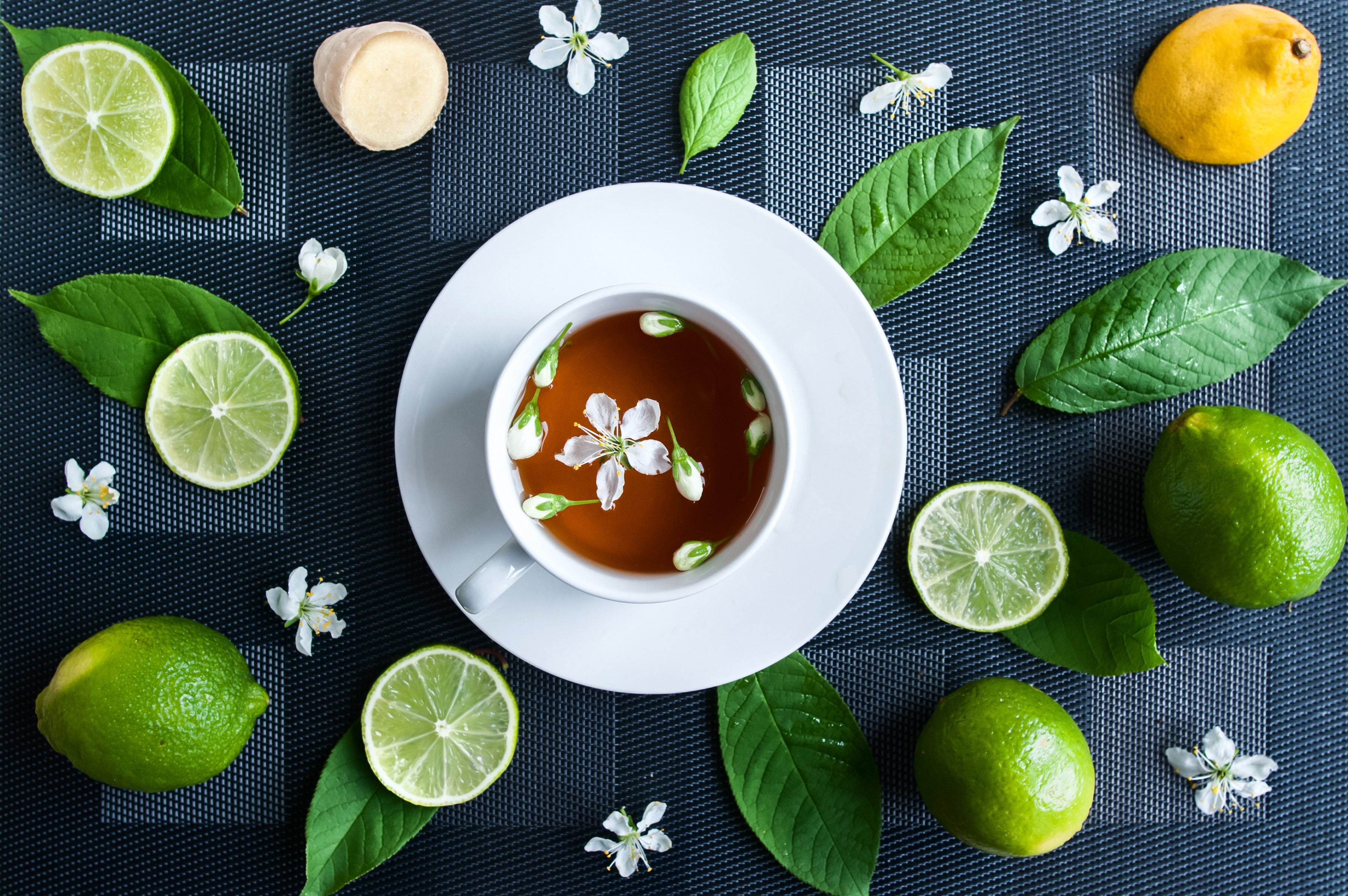 Tea with lime, ginger, and flowers HD Wallpaper