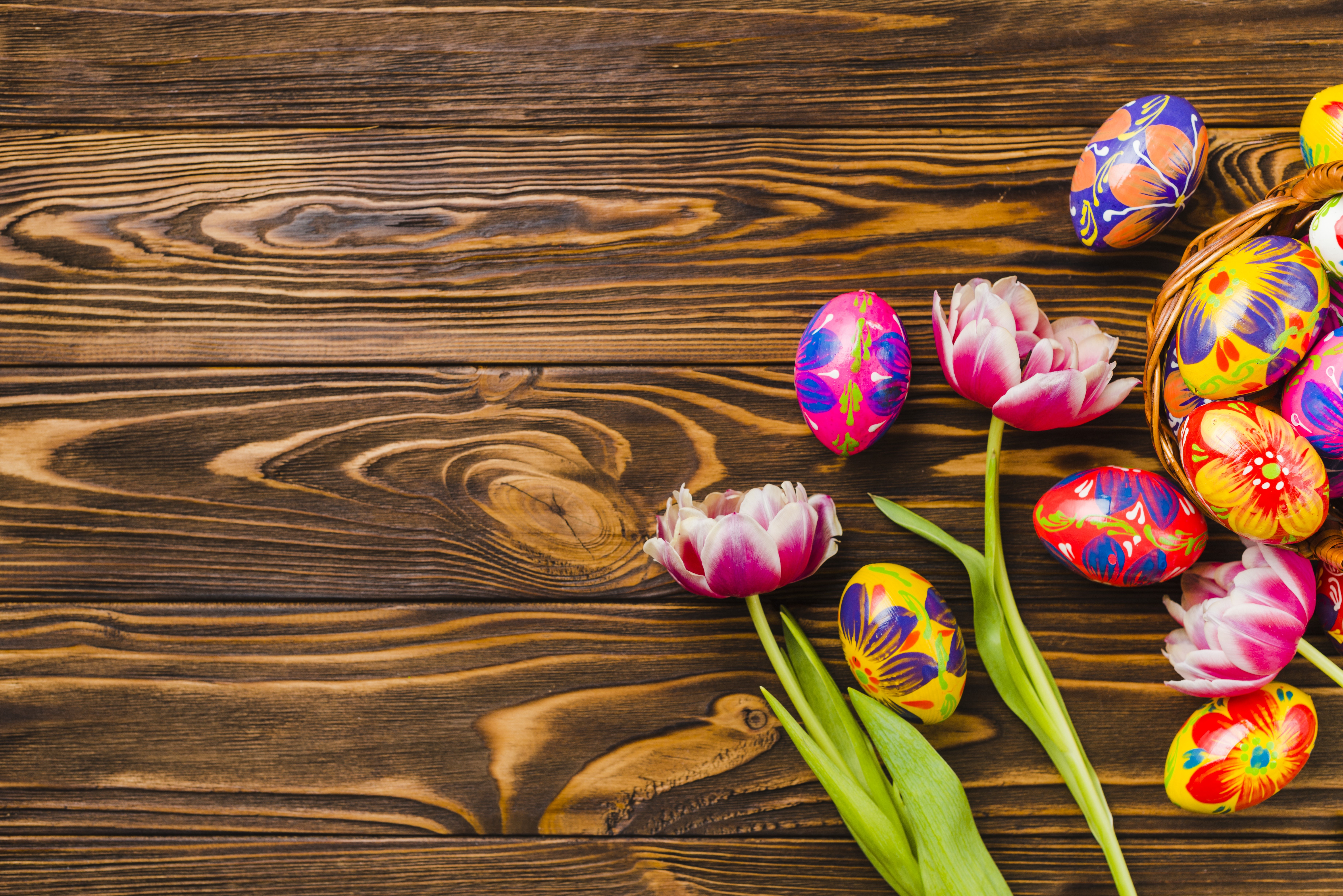 Easter eggs and tulips on wood planks HD Wallpaper