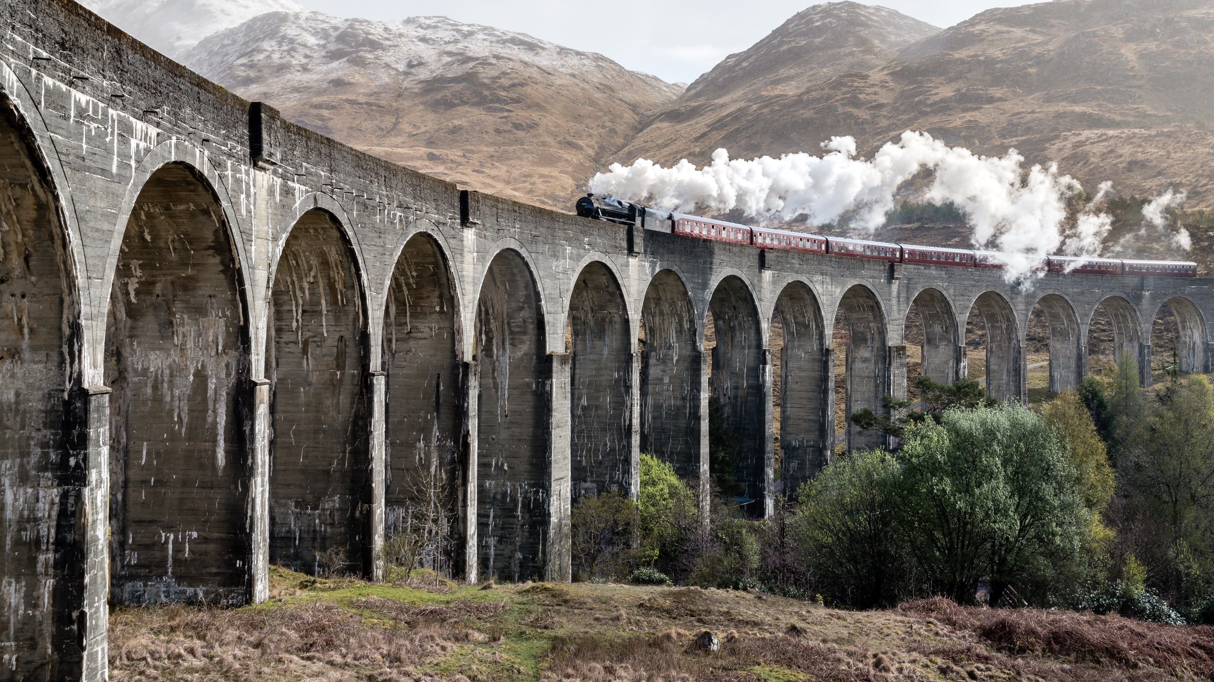 Steam train crossing Glenfinnan Viaduct, Scotland HD Wallpaper