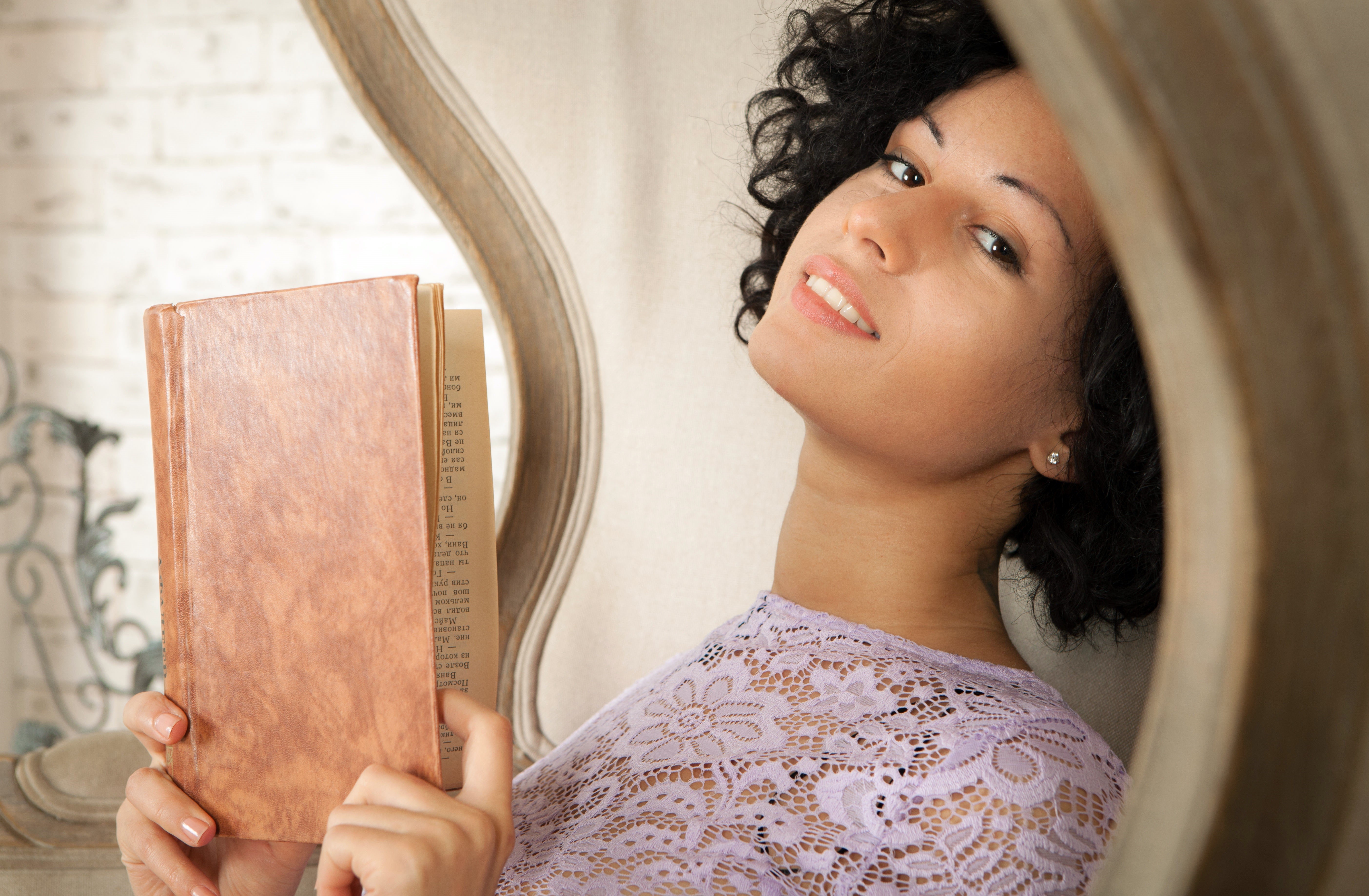 Brunette girl reading a book HD Wallpaper