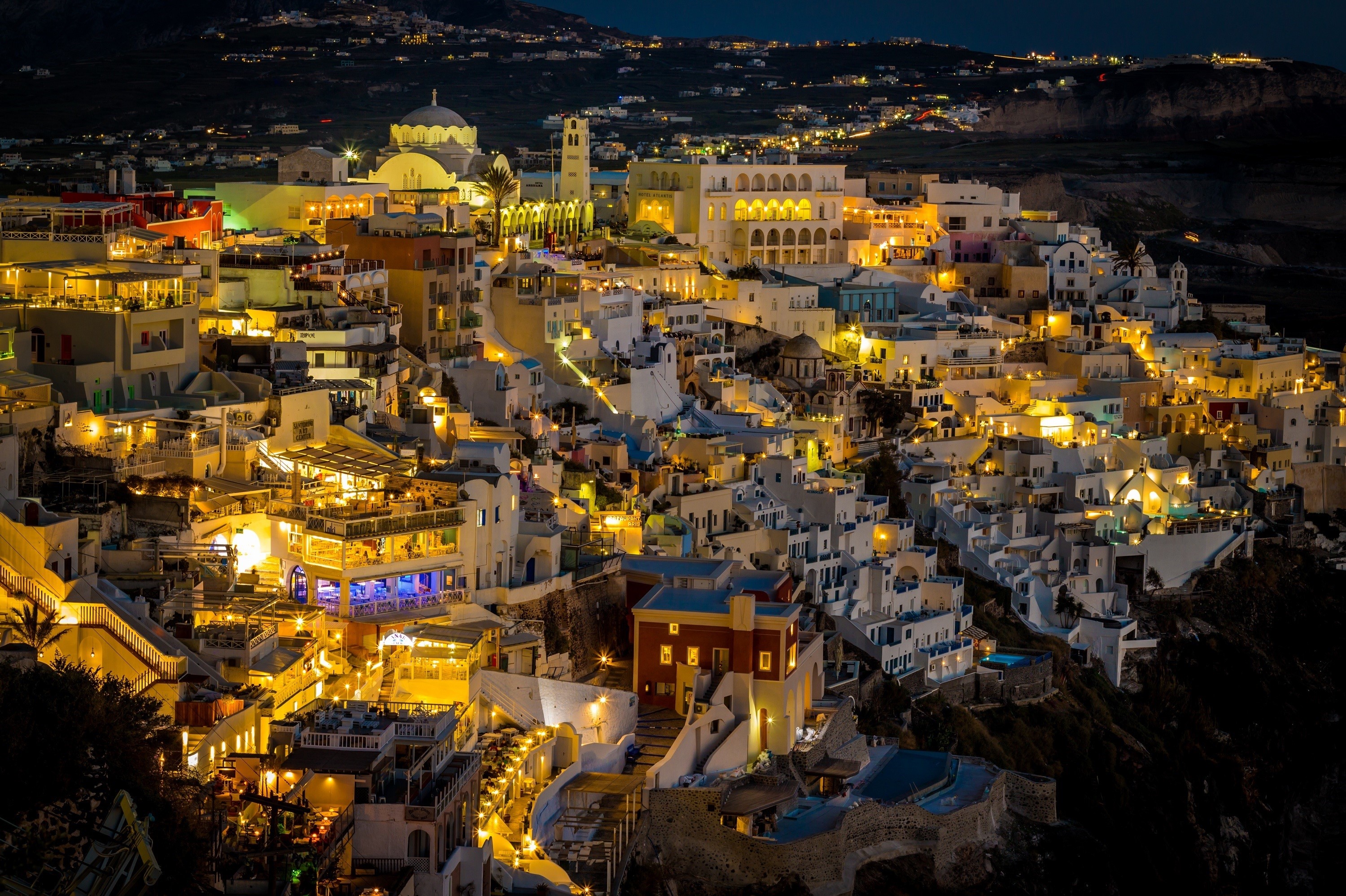Santorini, Greece at night with illuminated buildings HD Wallpaper