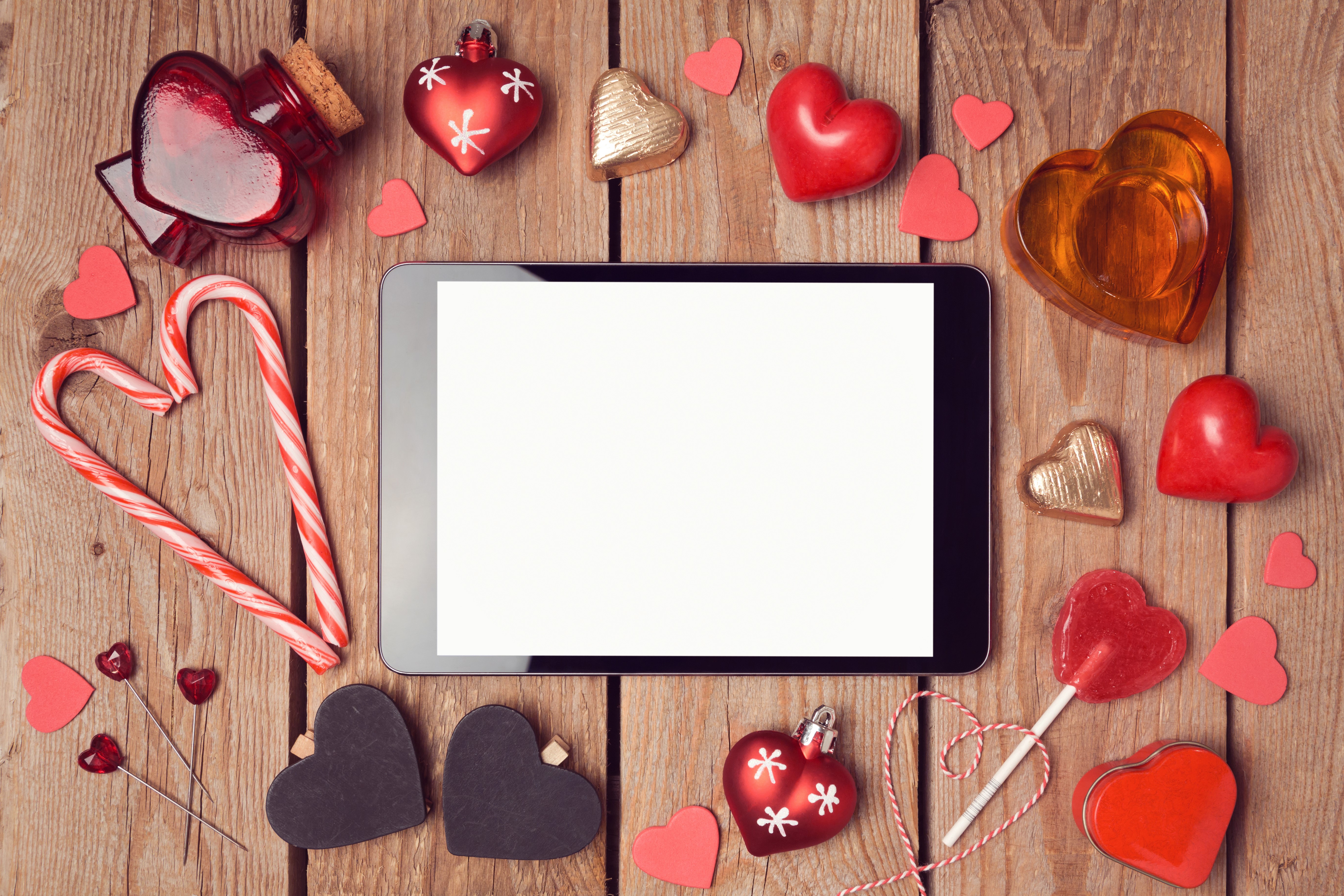 Valentine's Day tablet with sweets and heart decorations HD Wallpaper