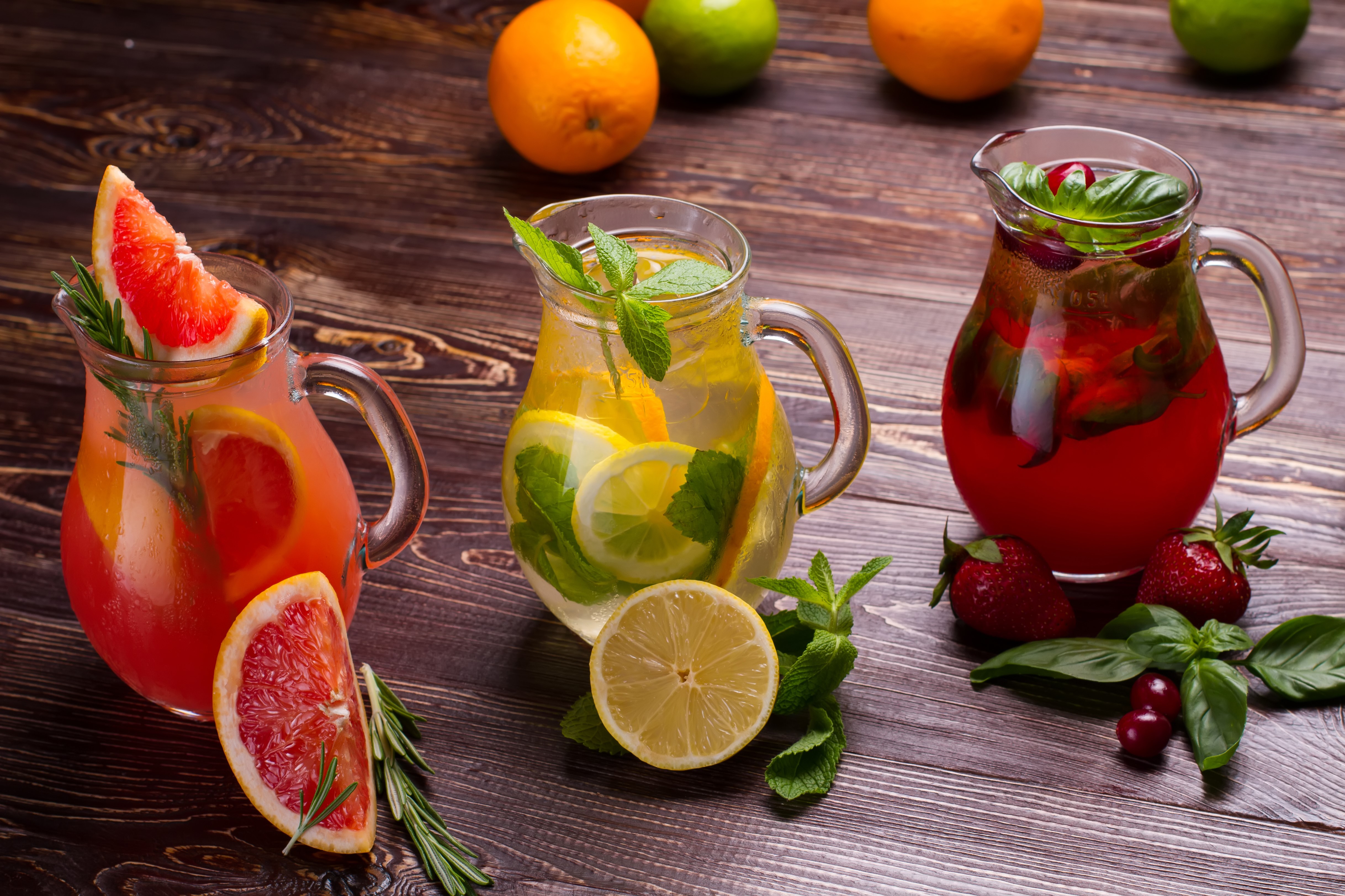 Grapefruit, Lemon, and Strawberry Drinks in Jugs HD Wallpaper