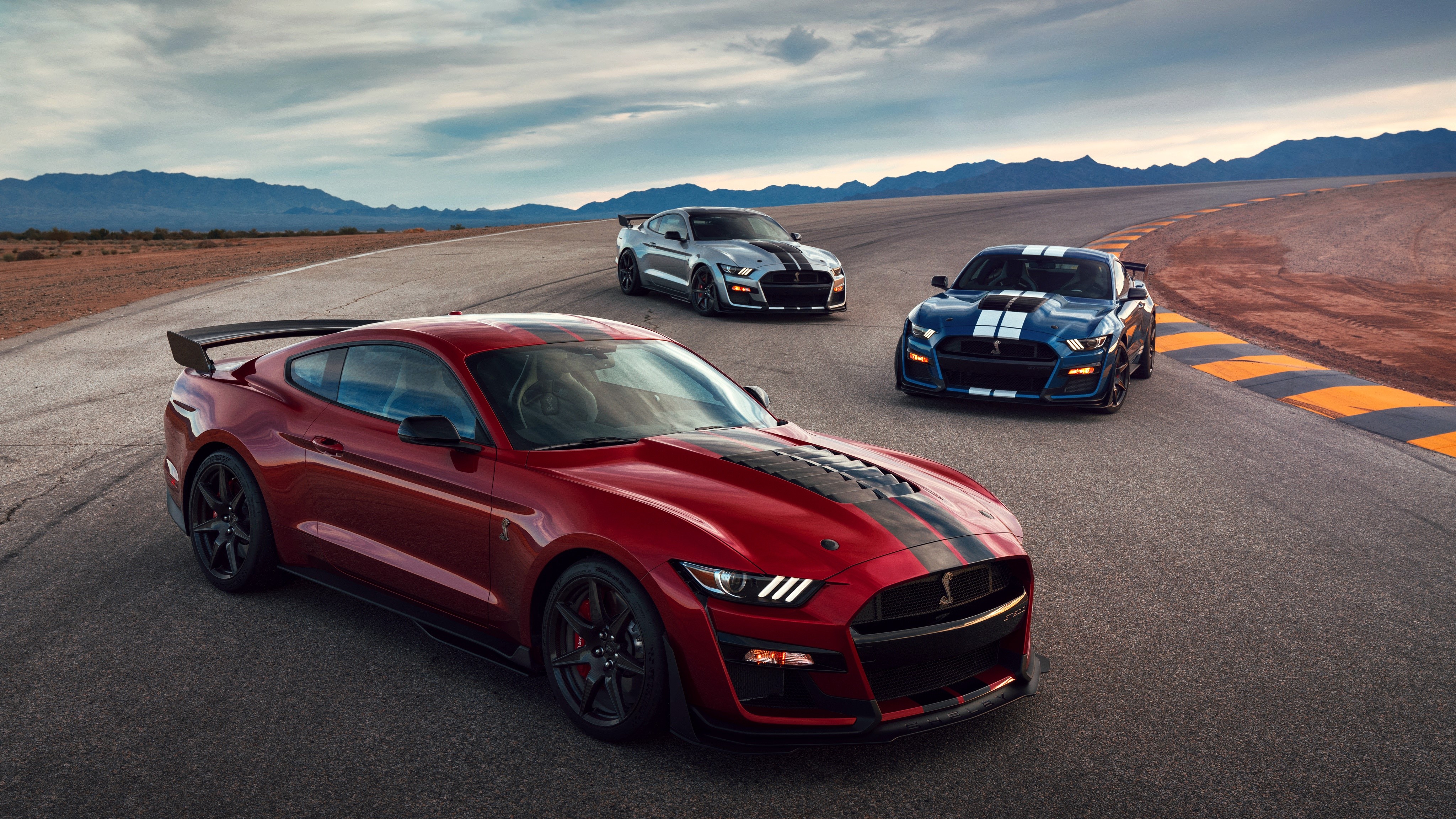 Three Ford Mustang Shelby GT500 cars on a track HD Wallpaper
