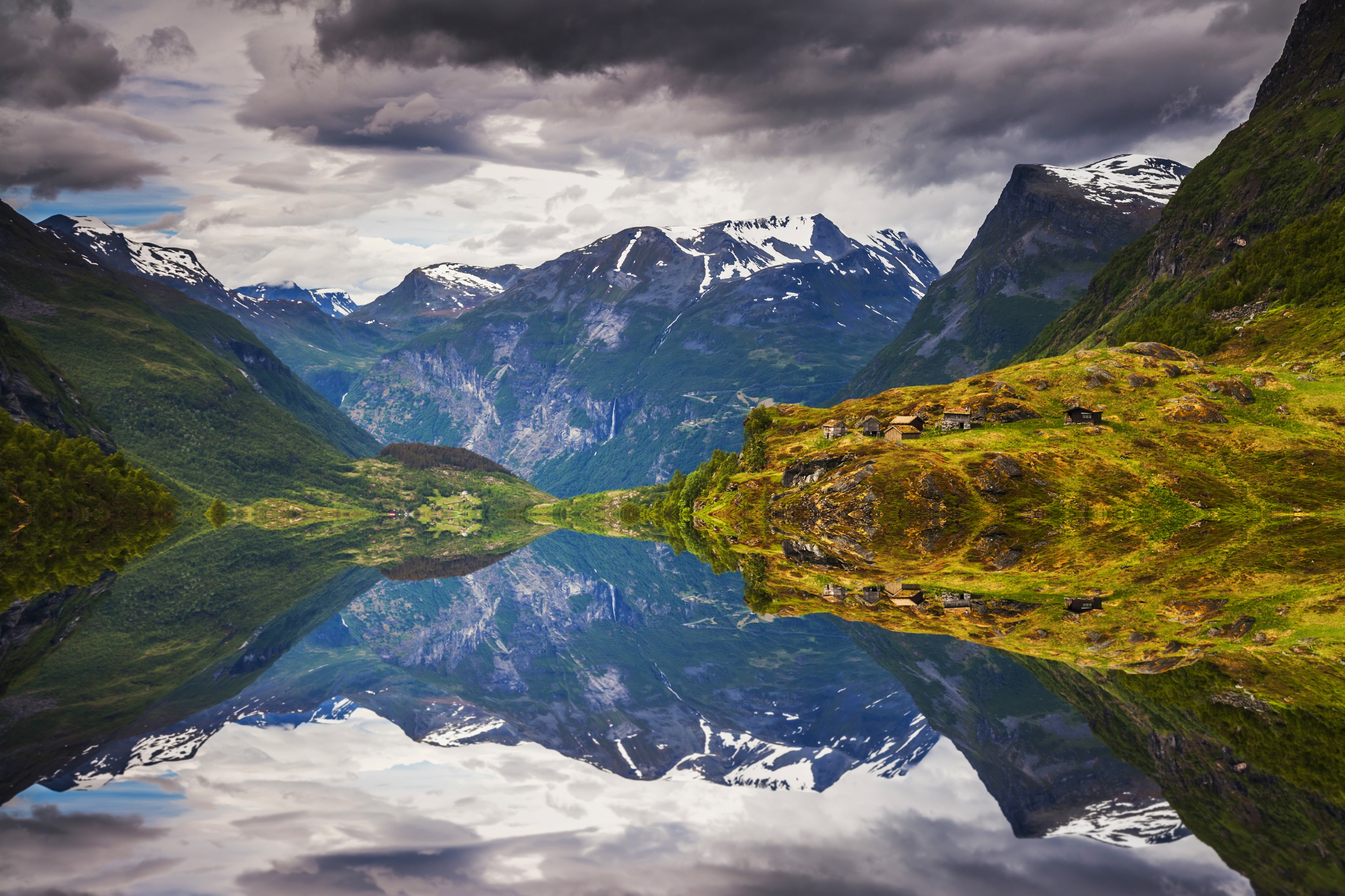 Mountains reflected in a calm bay in Norway HD Wallpaper