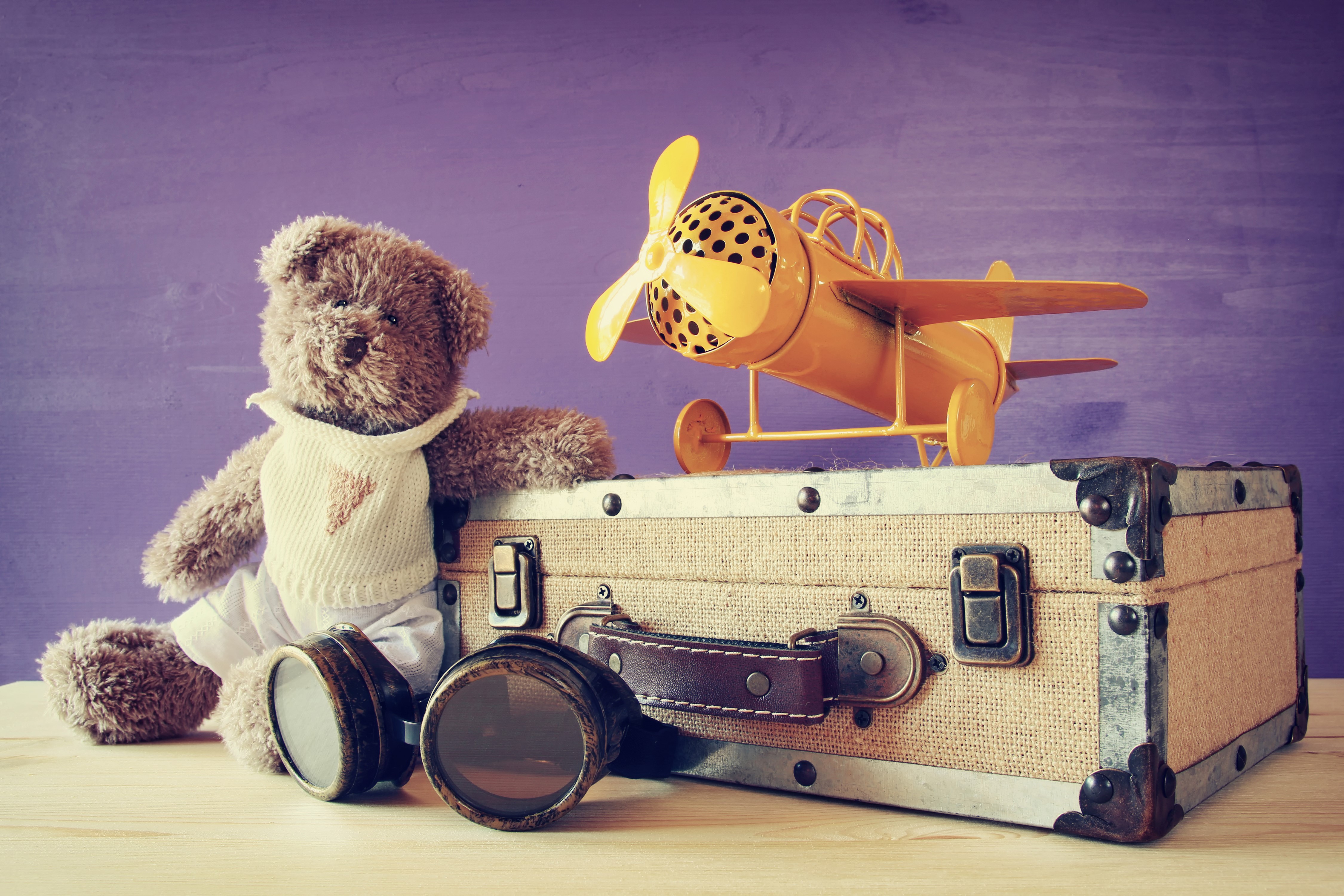 4K Teddy bear with airplane and suitcase HD Wallpaper