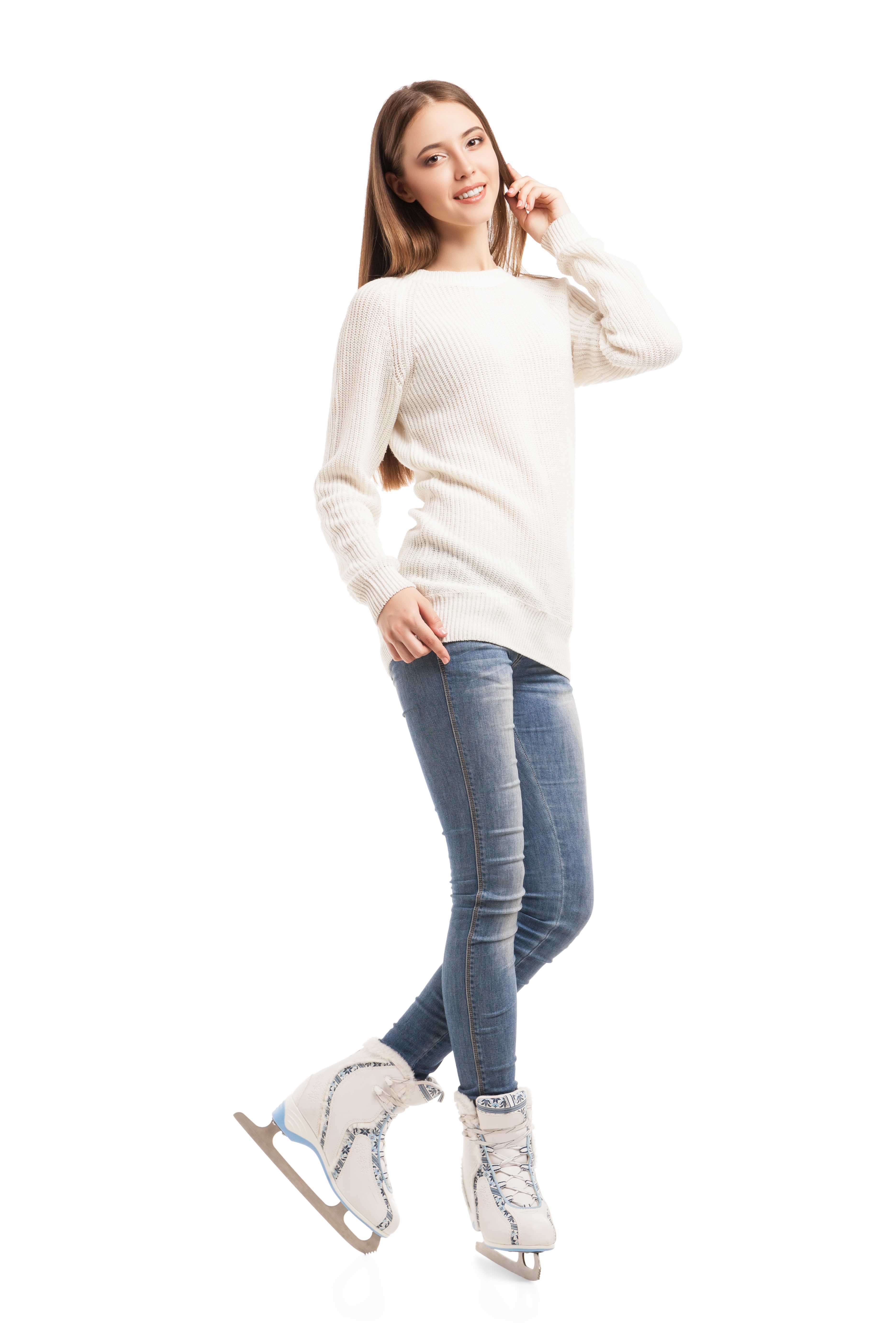 Young woman in ice skates, sweater, and jeans HD Phone Wallpaper