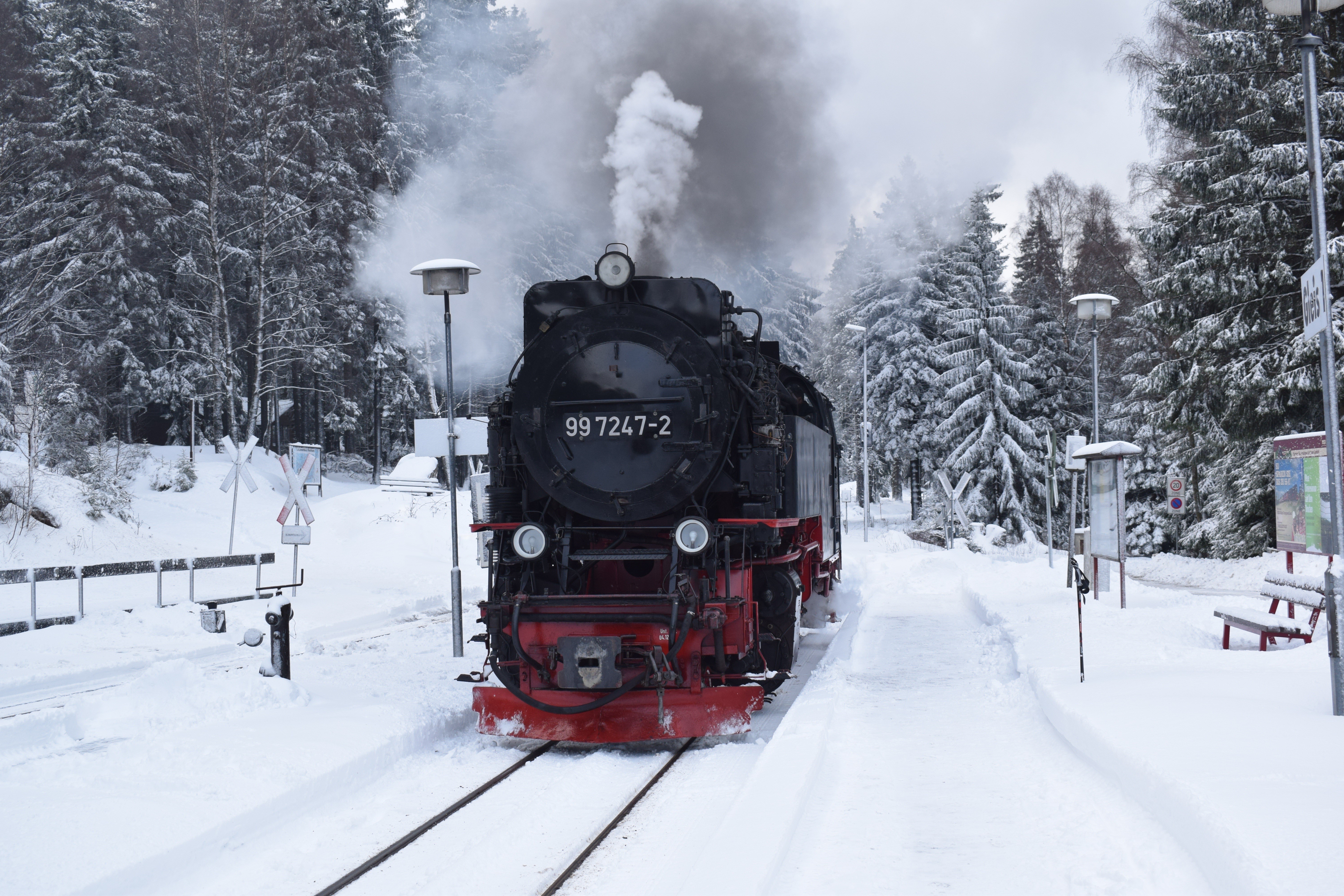 Steam train 99 7247-2 in a snowy forest HD Wallpaper
