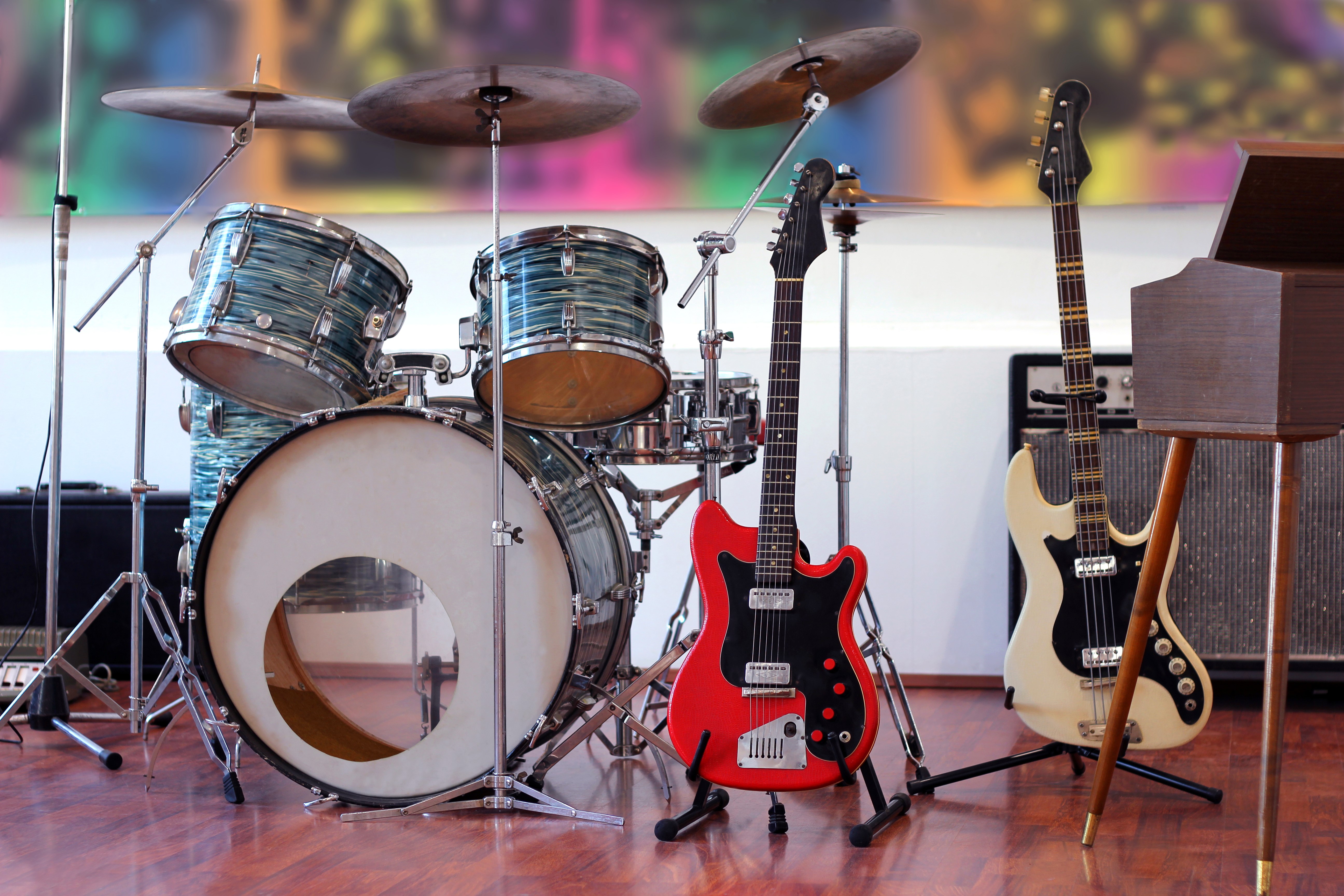 Drum set and guitars with amplifiers HD Wallpaper
