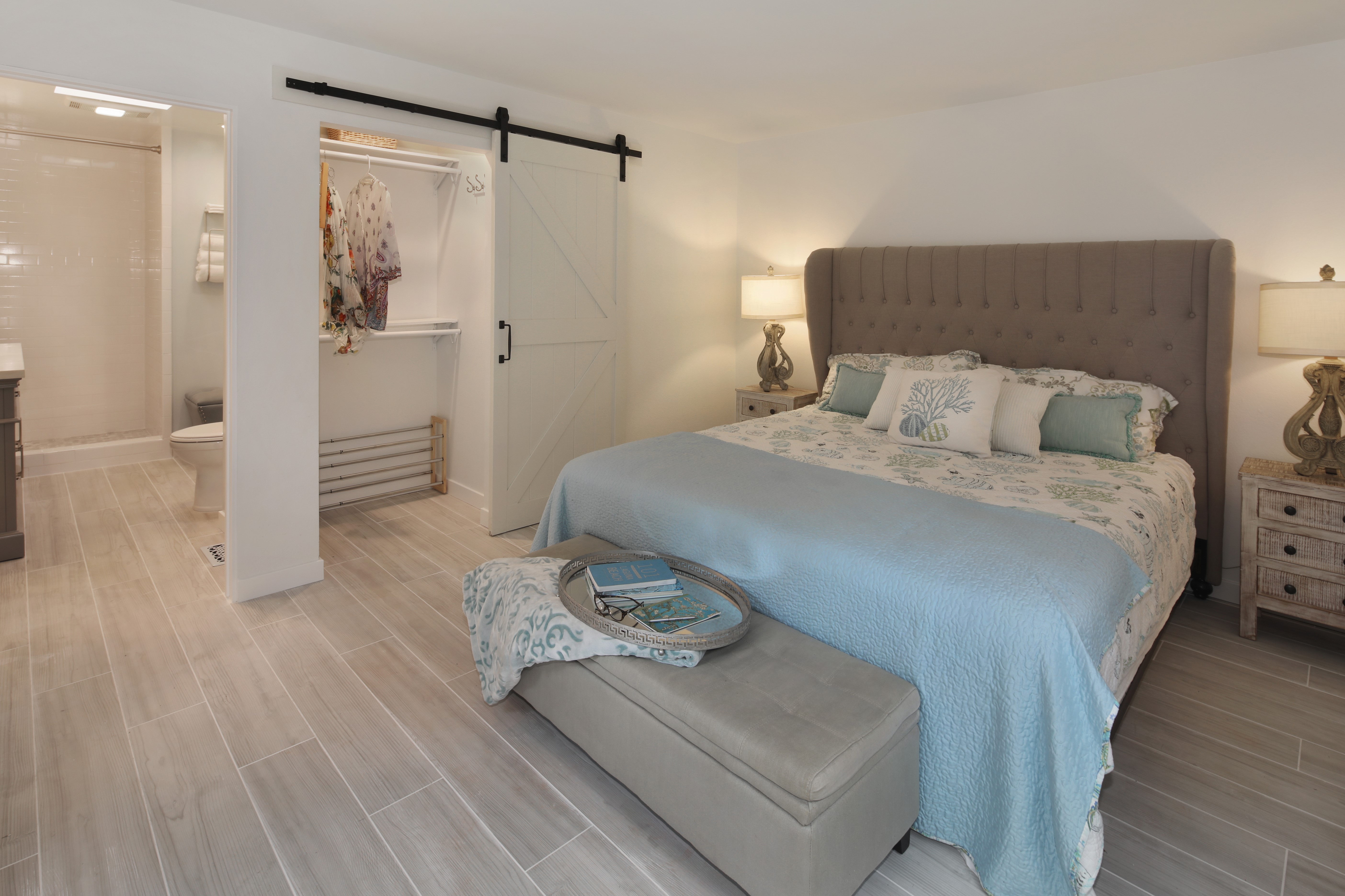 Bedroom with Barn Door and Attached Bathroom HD Wallpaper