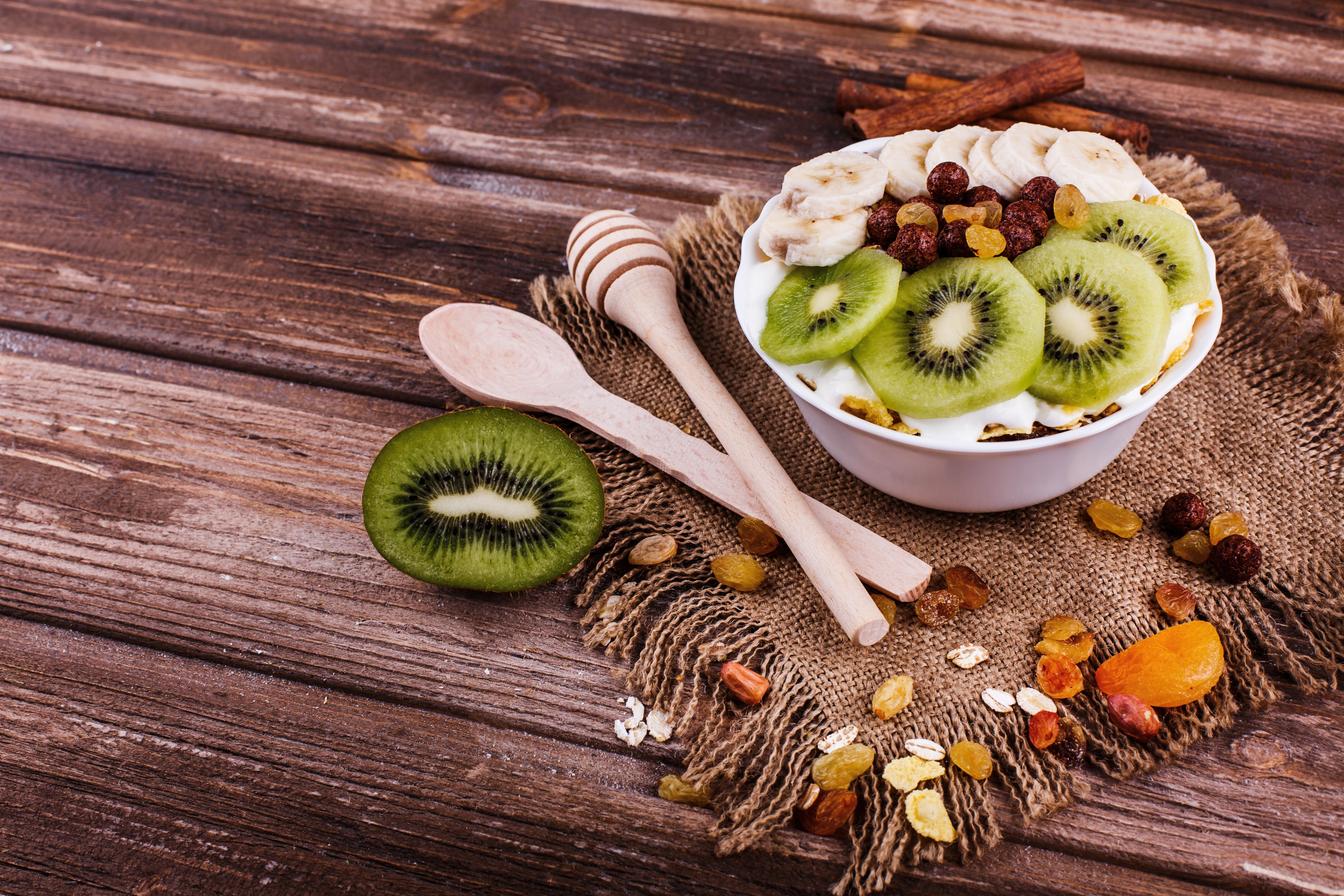 Muesli with Kiwi, Banana, and Raisins on Wood HD Wallpaper