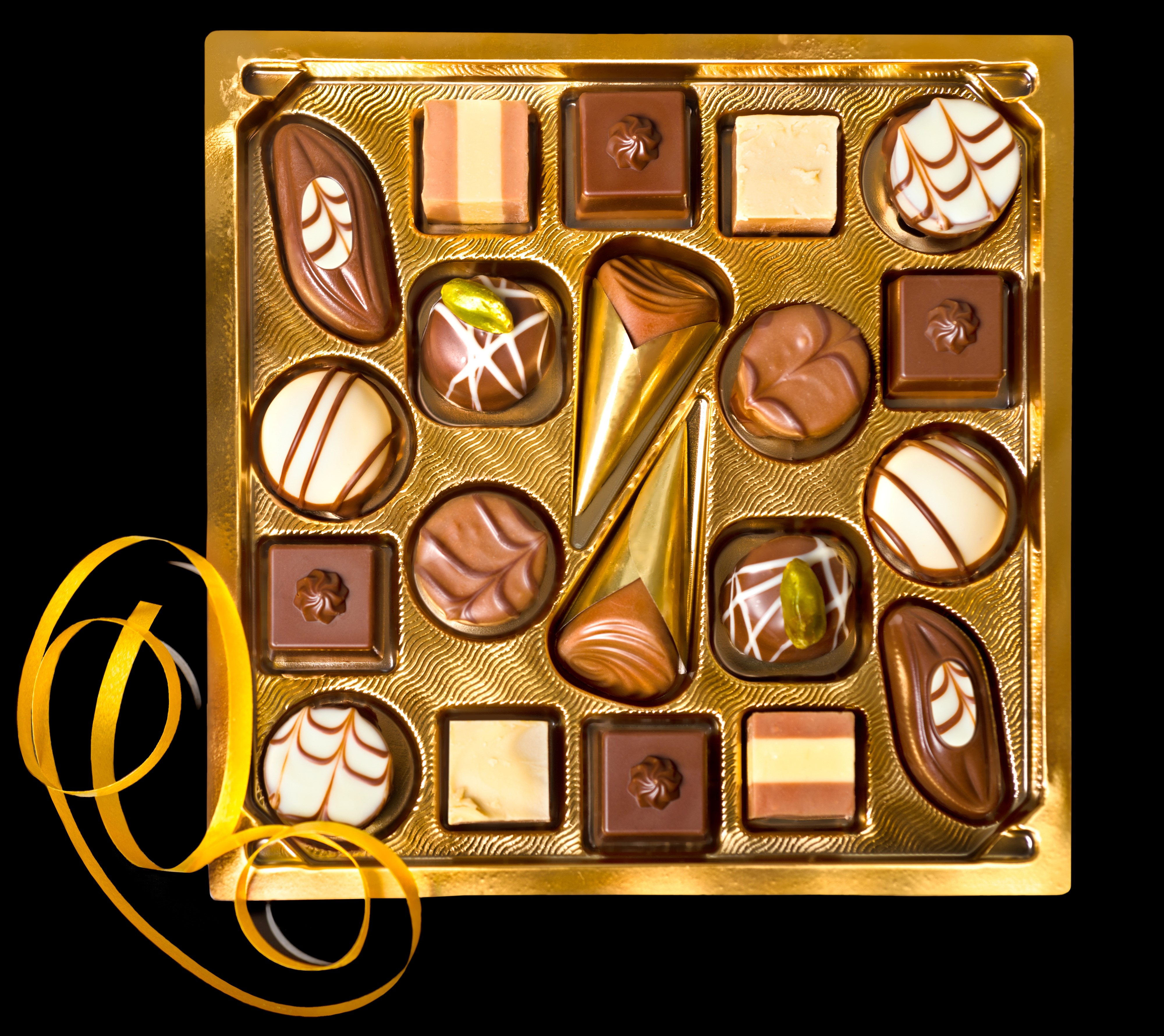 Box of assorted chocolates with yellow ribbon HD Wallpaper
