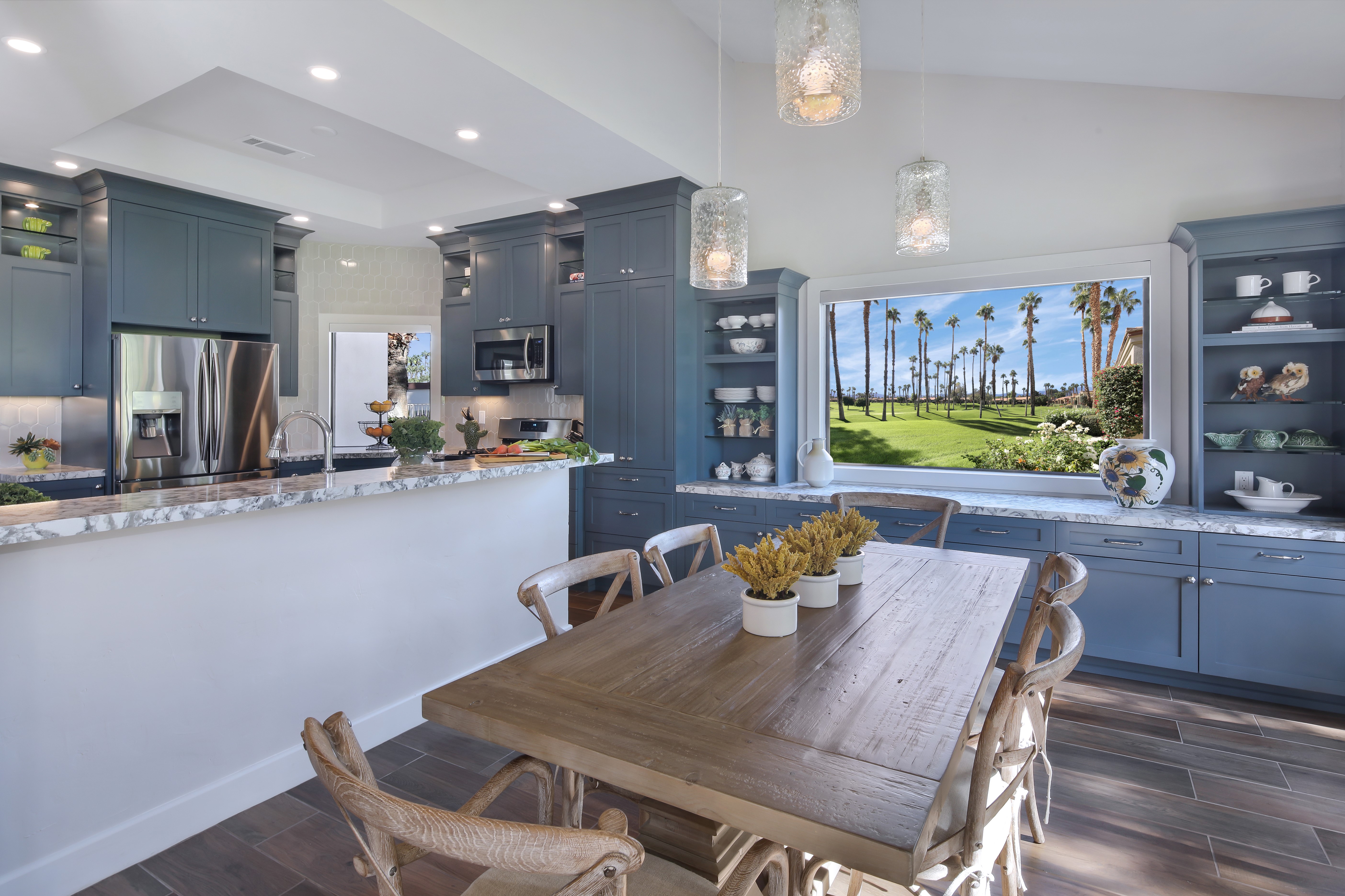 Kitchen with Dining Table and Palm Tree View HD Wallpaper