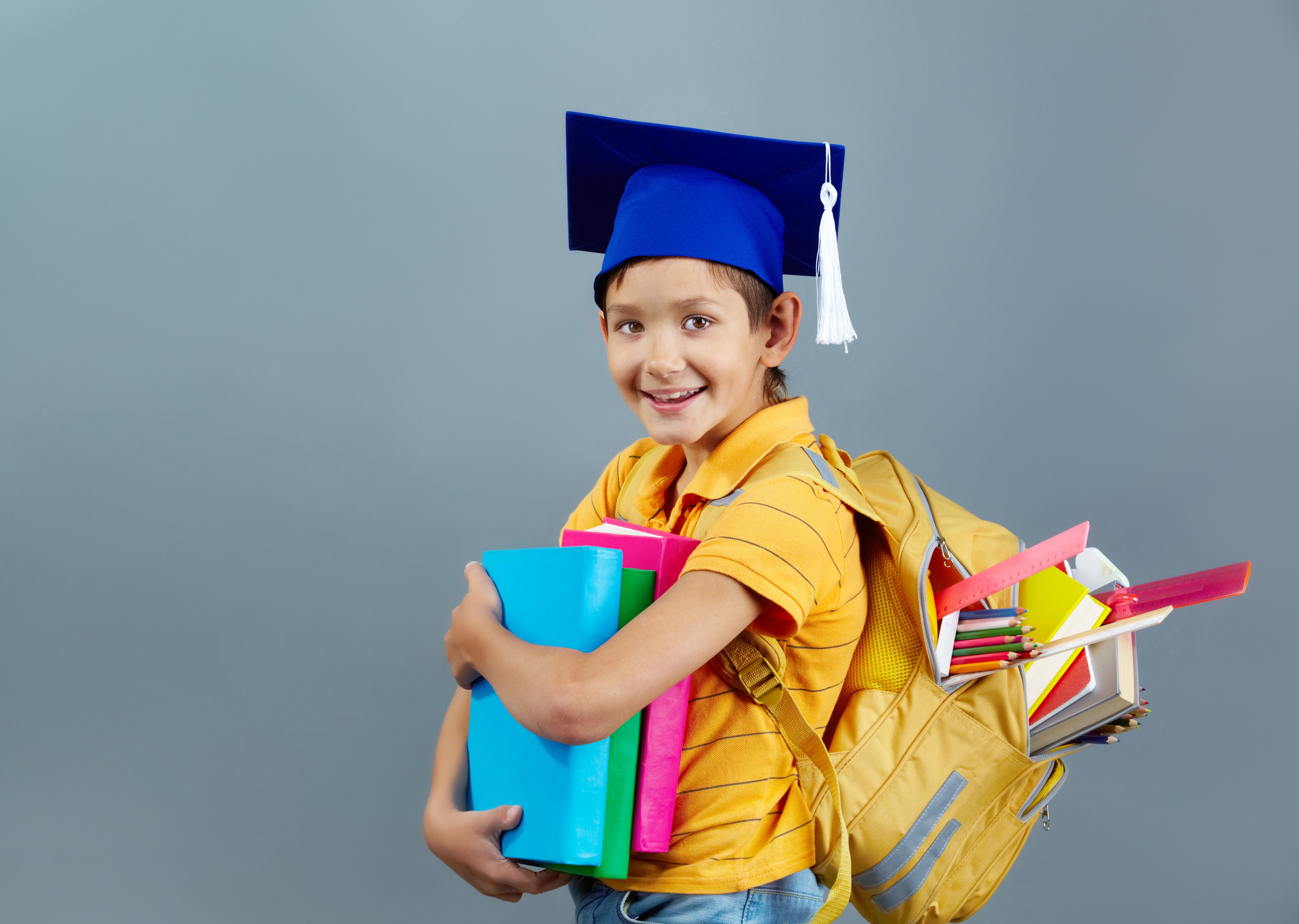 Boy with Graduation Cap and Books HD Wallpaper