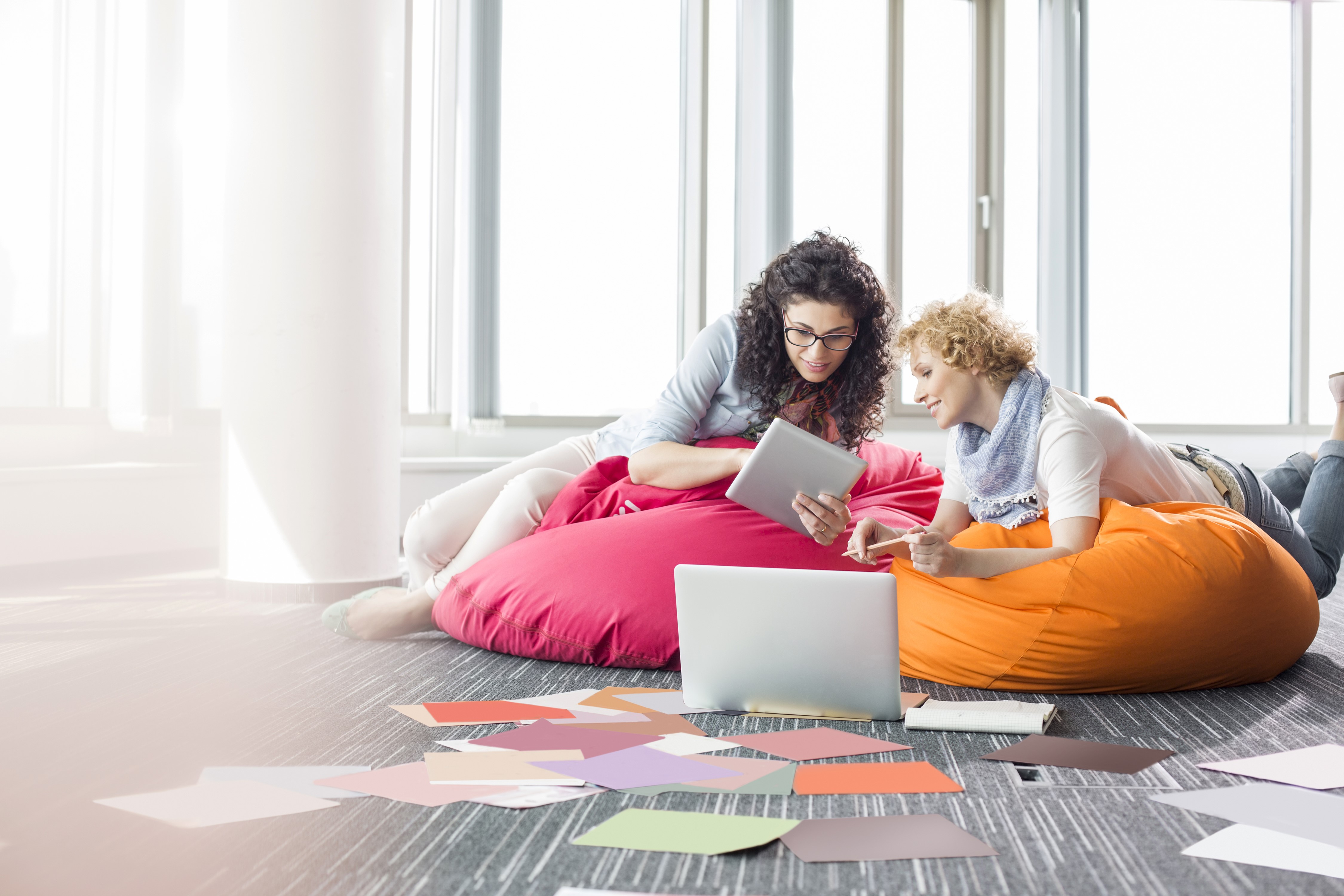 Two women with tablet and laptop HD Wallpaper