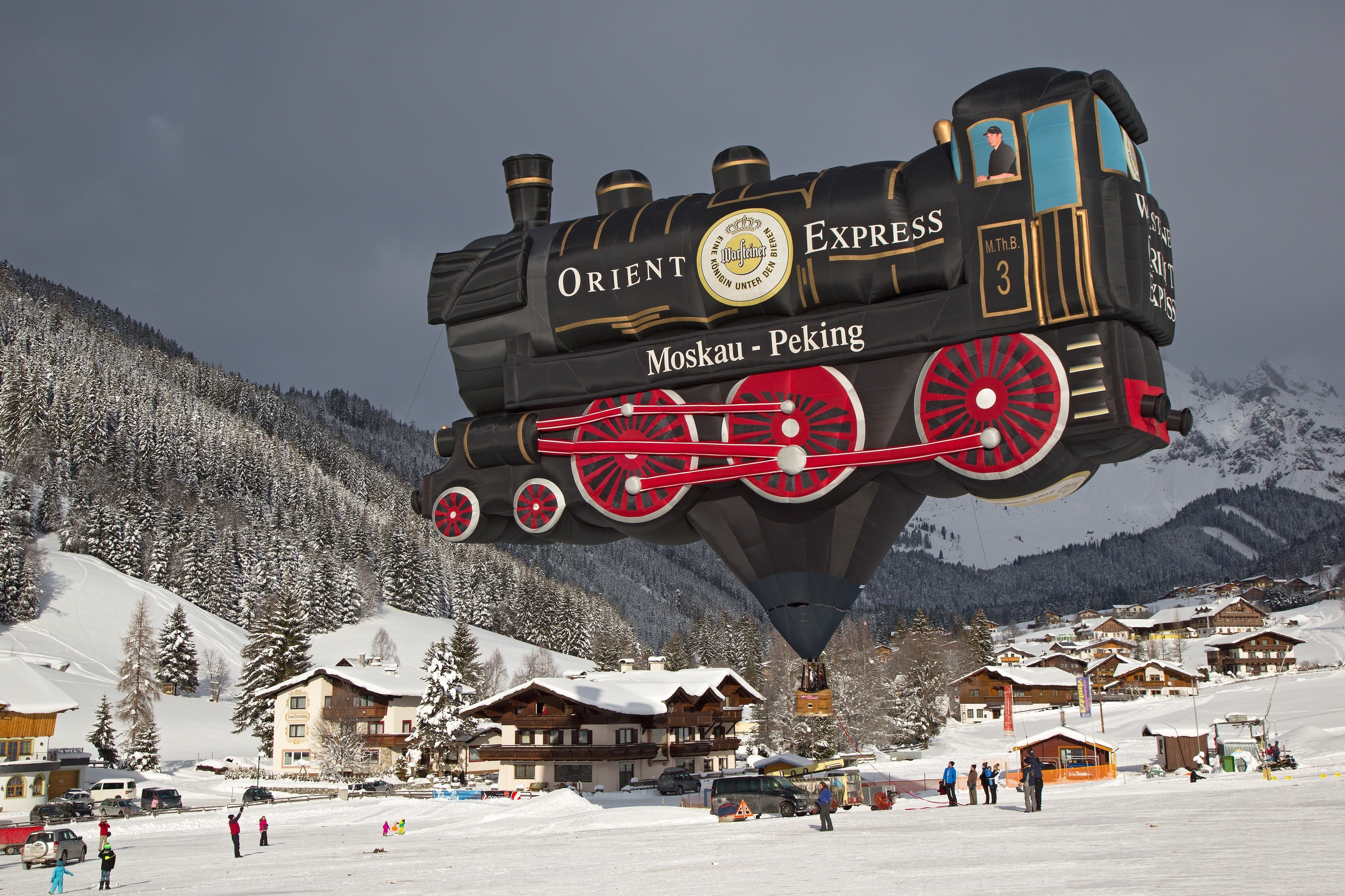 Orient Express Hot Air Balloon over Snowy Village HD Wallpaper