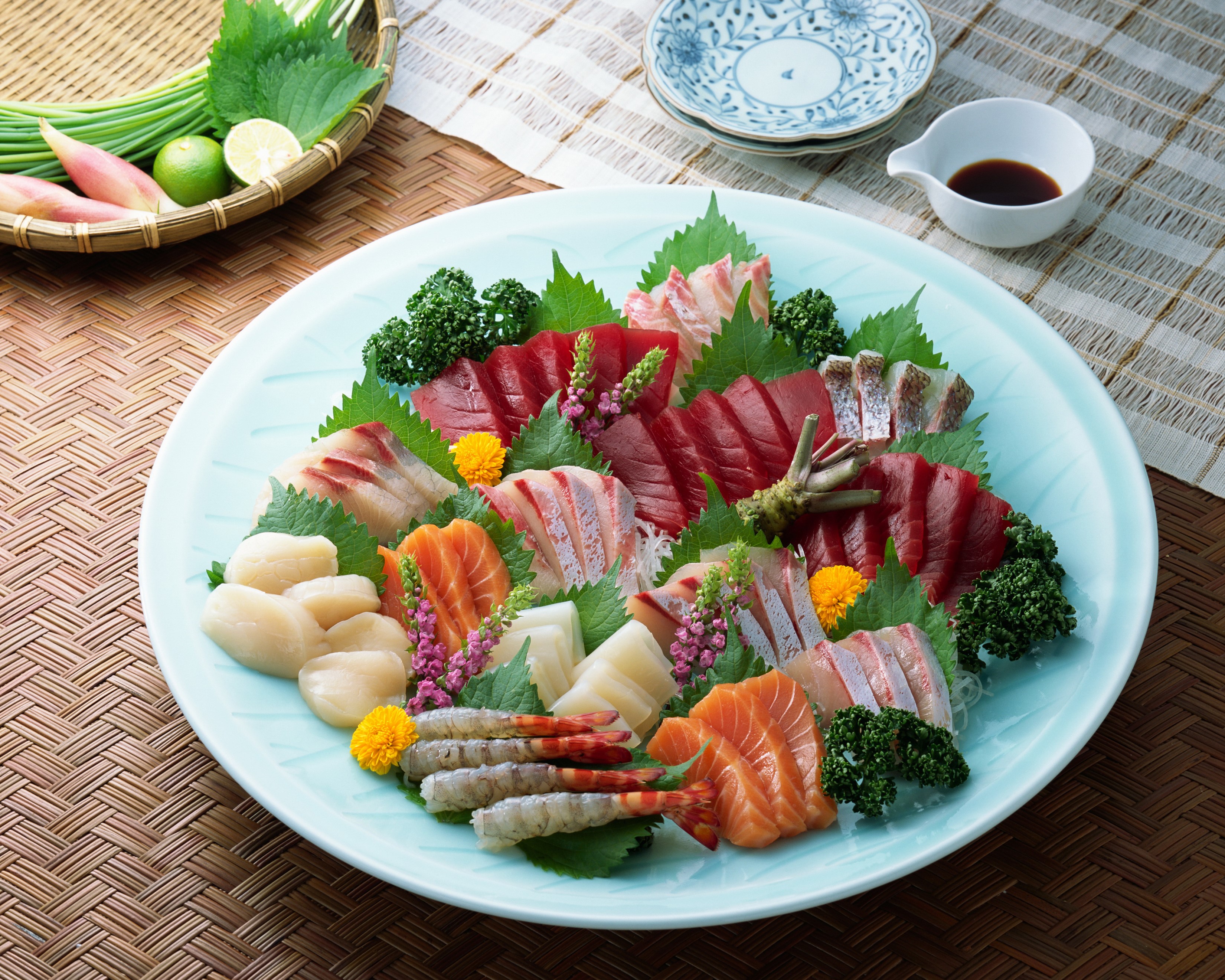 Sashimi platter with assorted seafood and garnishes HD Wallpaper
