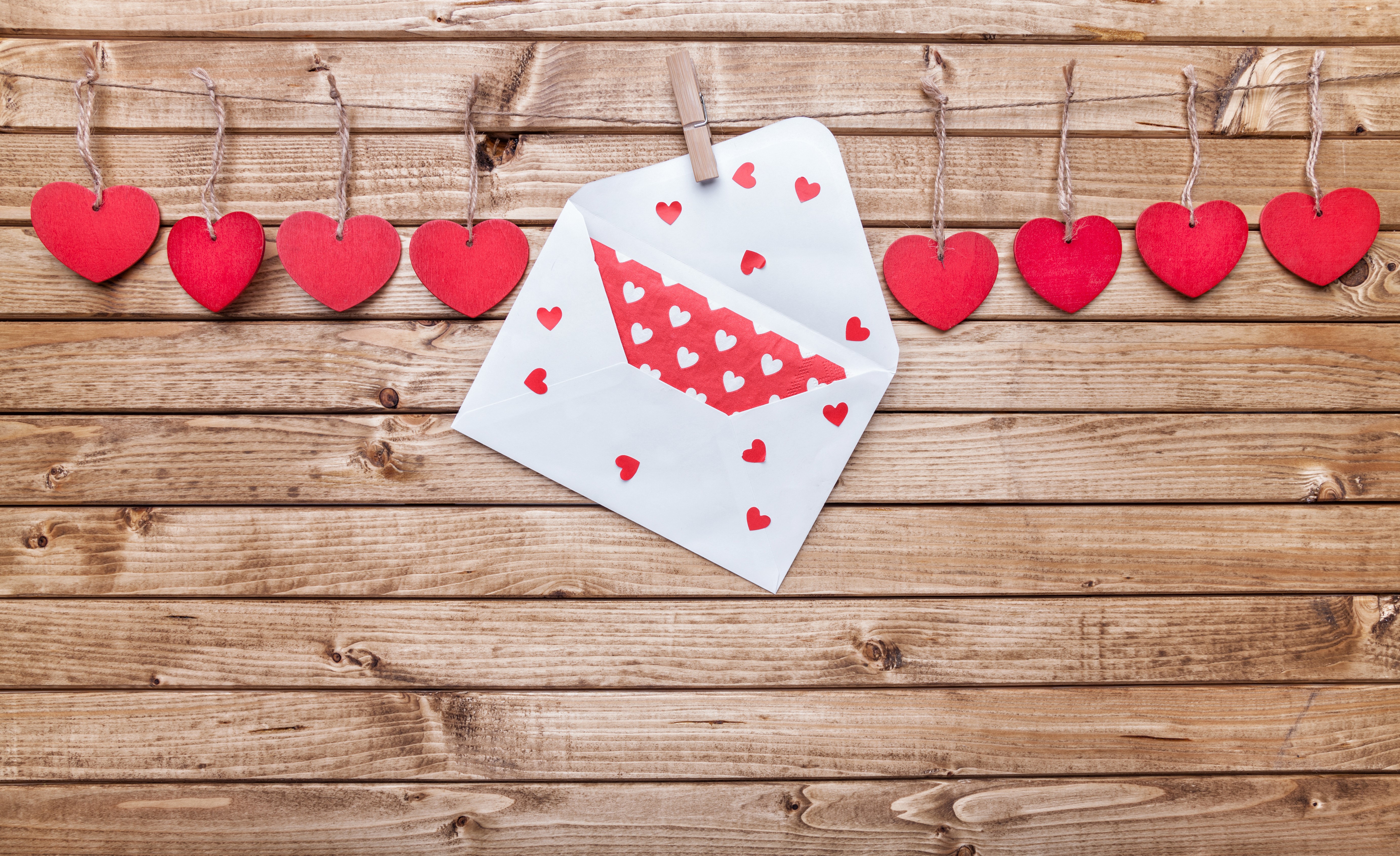 Valentine's Day hearts and envelope on wood planks HD Wallpaper