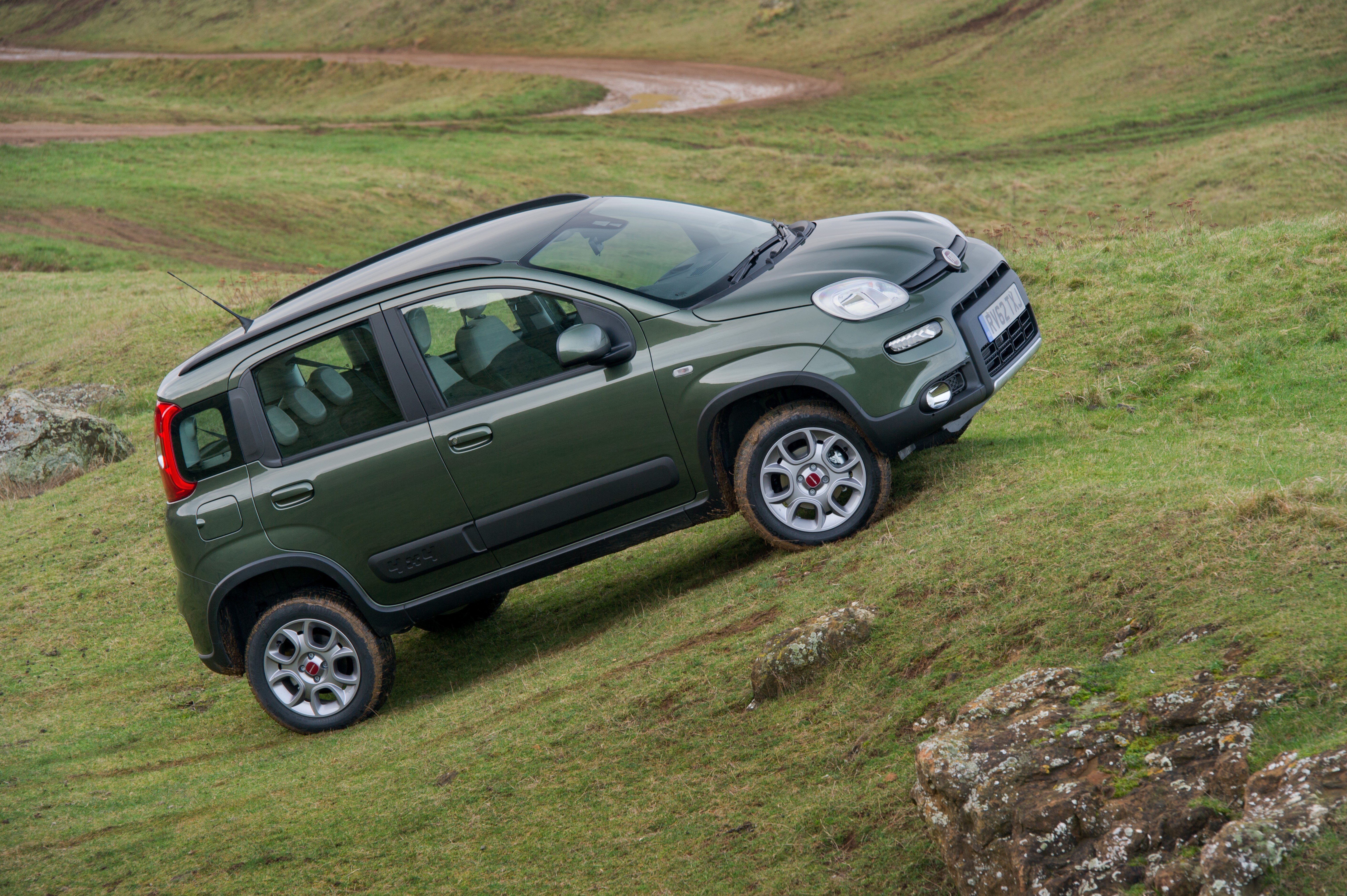 Green Fiat Panda 4x4 on a grassy hill HD Wallpaper