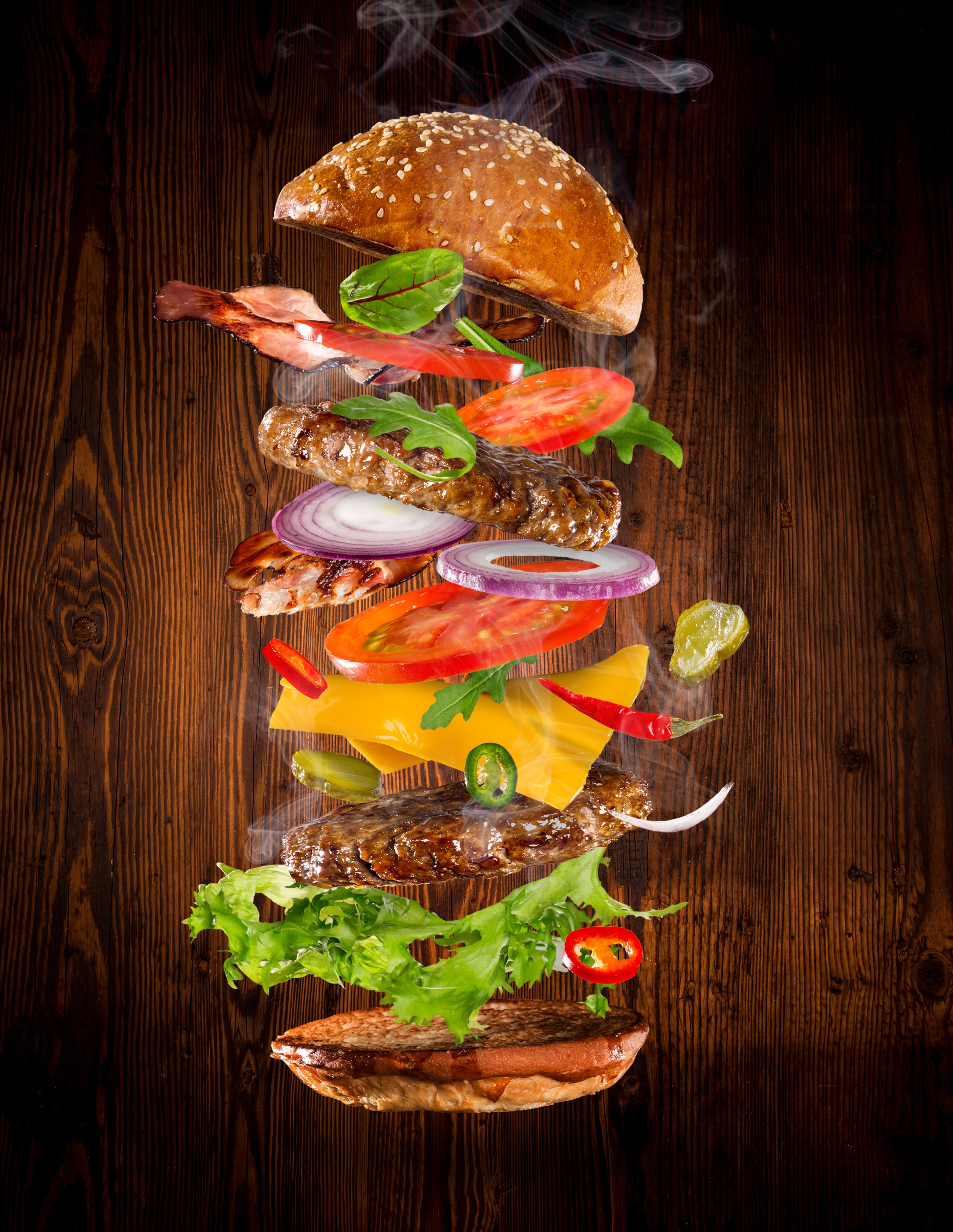 Deconstructed hamburger with flying ingredients HD Phone Wallpaper