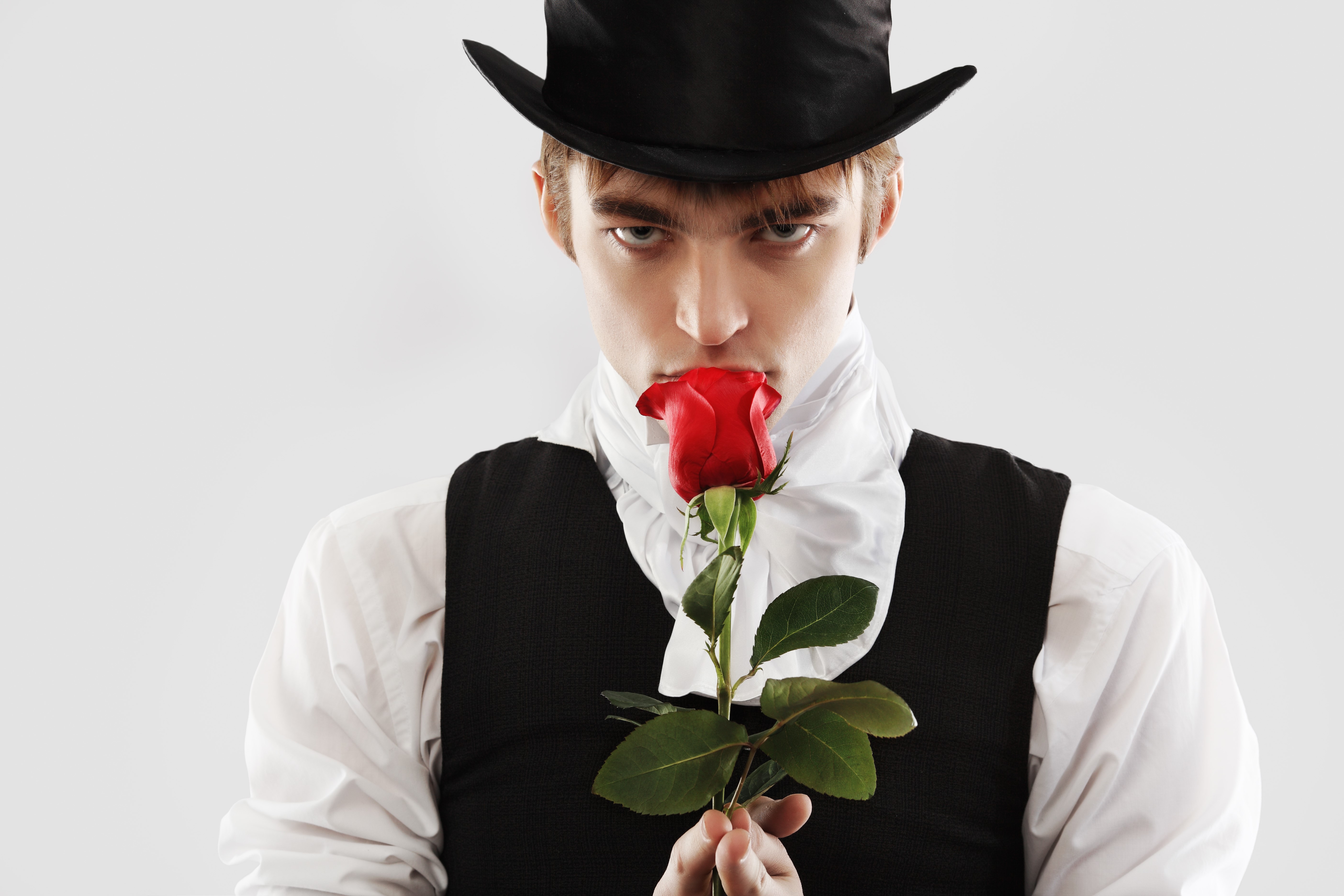 Man in Top Hat Smelling a Red Rose HD Wallpaper