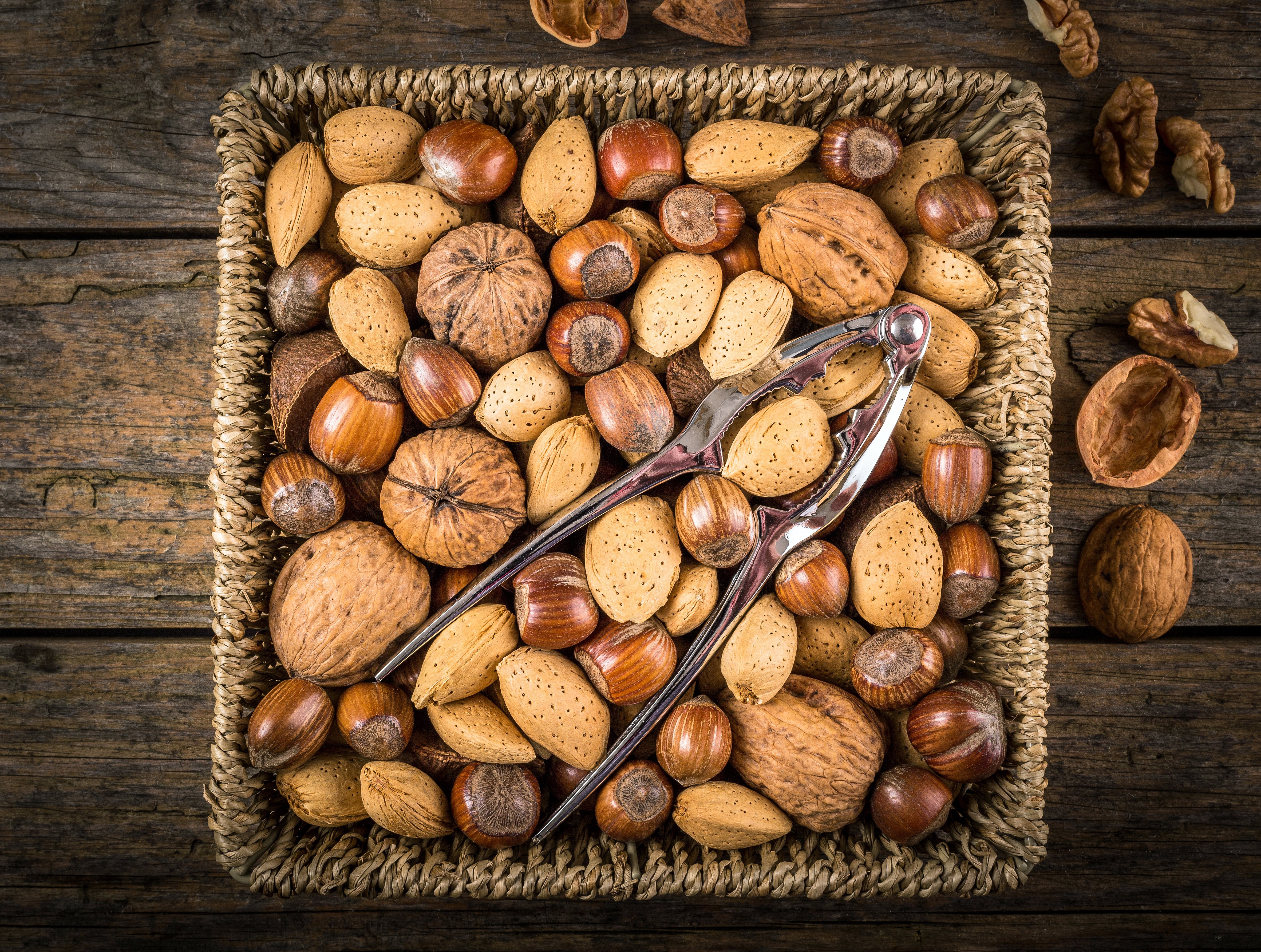 Assorted Nuts in Wicker Basket with Nutcracker HD Wallpaper