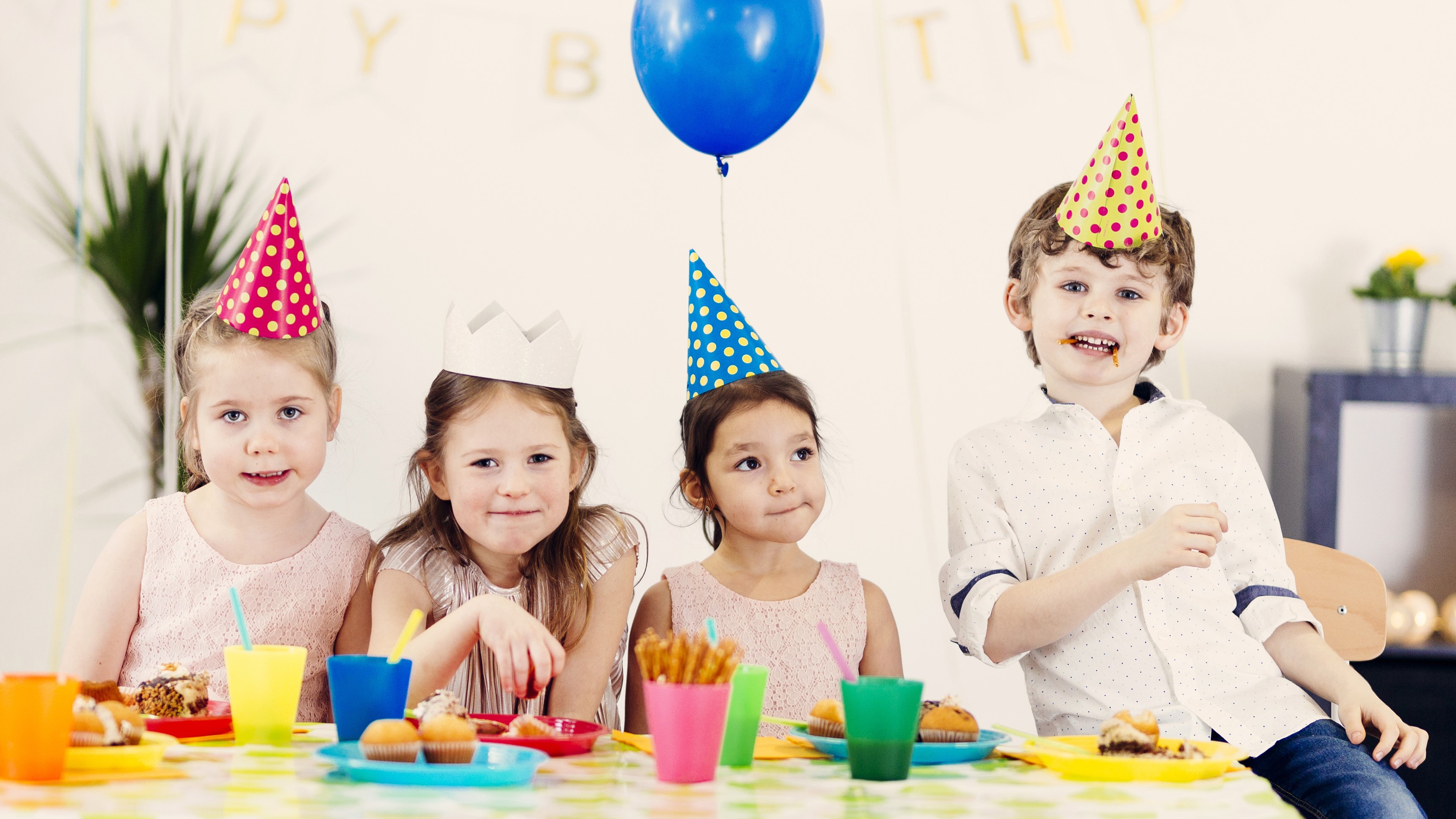 Children at a birthday party with party hats and cake HD Wallpaper